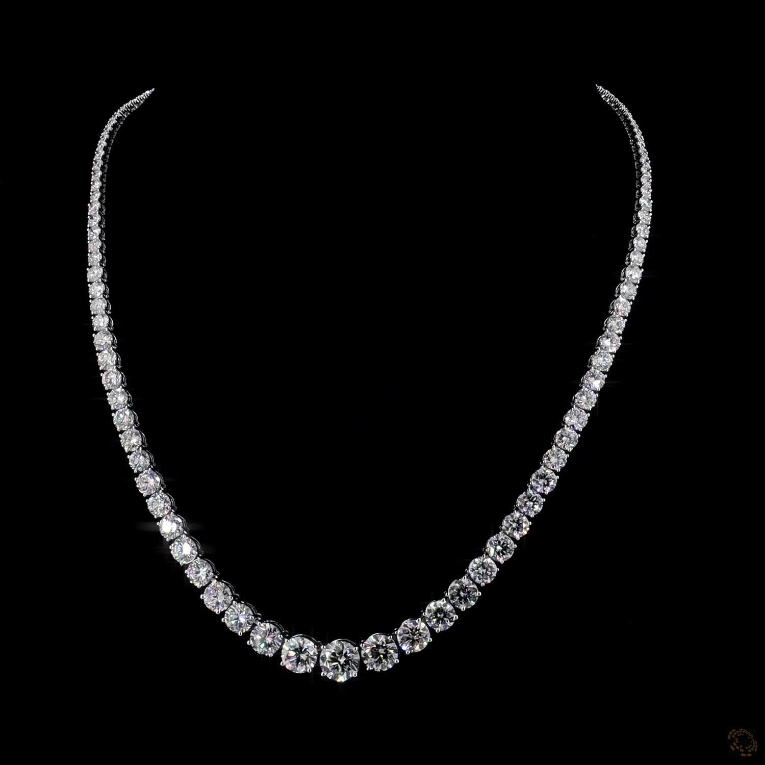 29.02 Ct Round Brilliant Cut diamonds seamlessly graduated from prominent center stones down to smaller accent stones toward the clasp