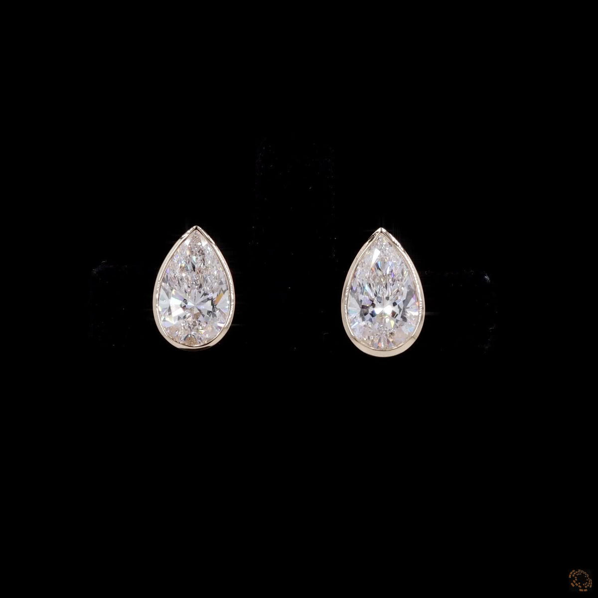2.14 Ct Bezel-Set Pear Cut Solitaire Diamond Stud Earrings in Yellow Gold