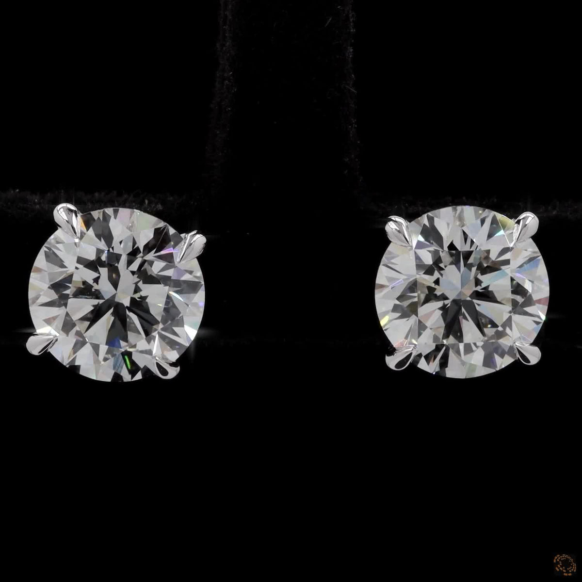 4.18 Ct Embrace quintessential elegance with these classic round brilliant-cut diamond solitaire stud earrings set in 14K white gold