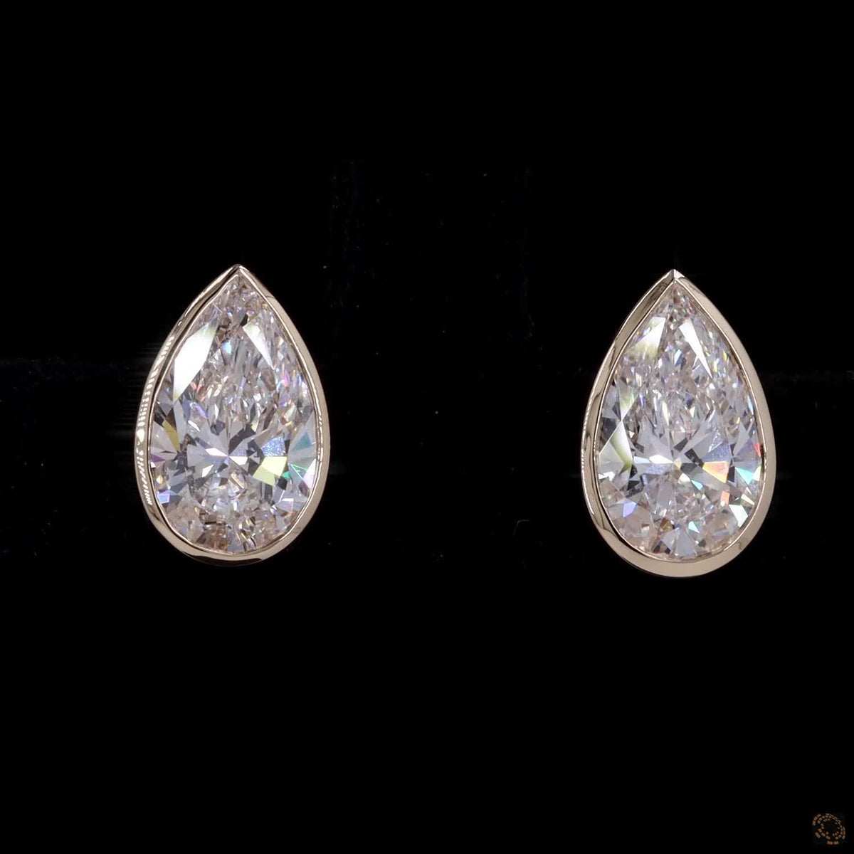 2.18 Ct Bezel-Set Pear Cut Diamond Stud Earrings in Yellow Gold
