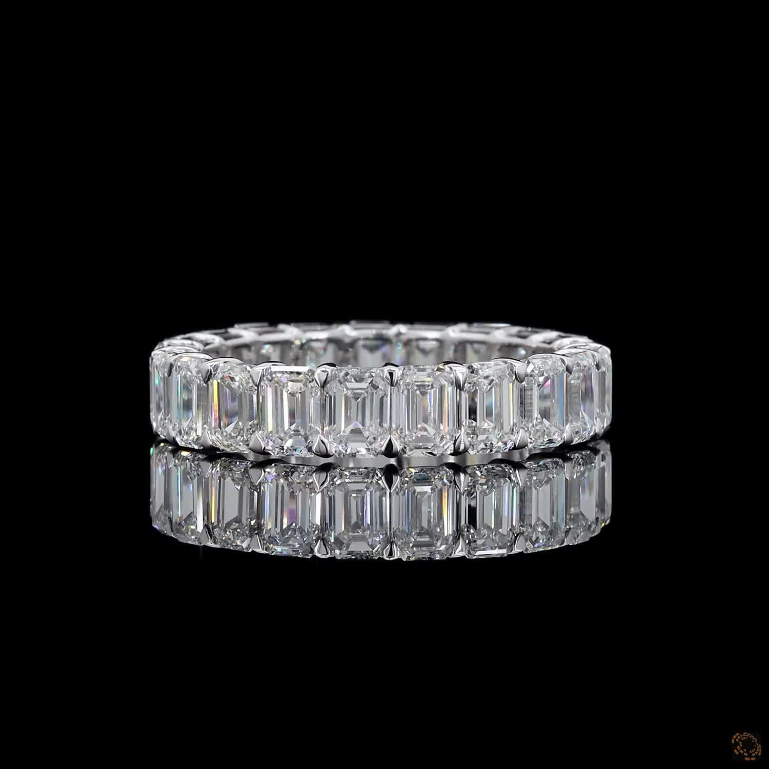 5.39 Ct Step-cut Emerald Diamonds continuously set around the full band
