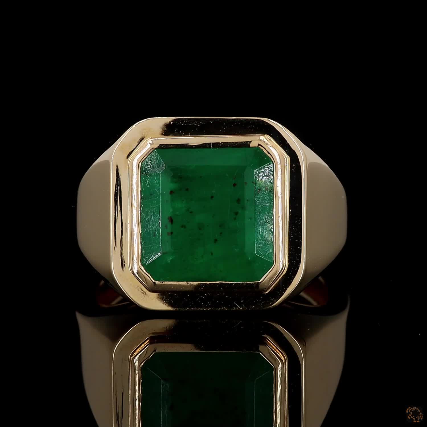 4.23 Ct Vibrant green emerald-cut emerald showcasing rich natural inclusions and classic step-faceted clarity