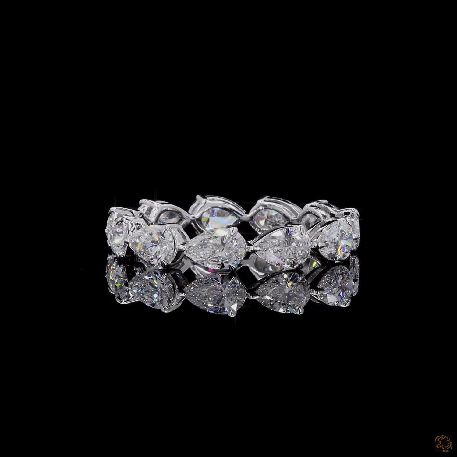 2.72 Ct Full eternity band featuring horizontally set East-West style pear-cut diamonds connected in an alternating head-to-tail arrangement
