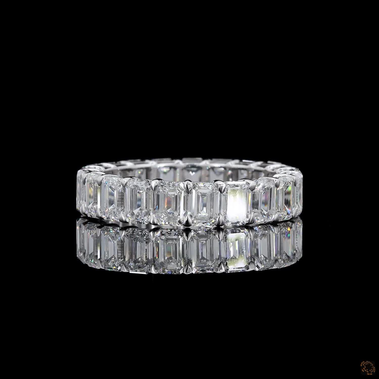 5.39 Ct Step-cut Emerald Diamonds continuously set around the full band