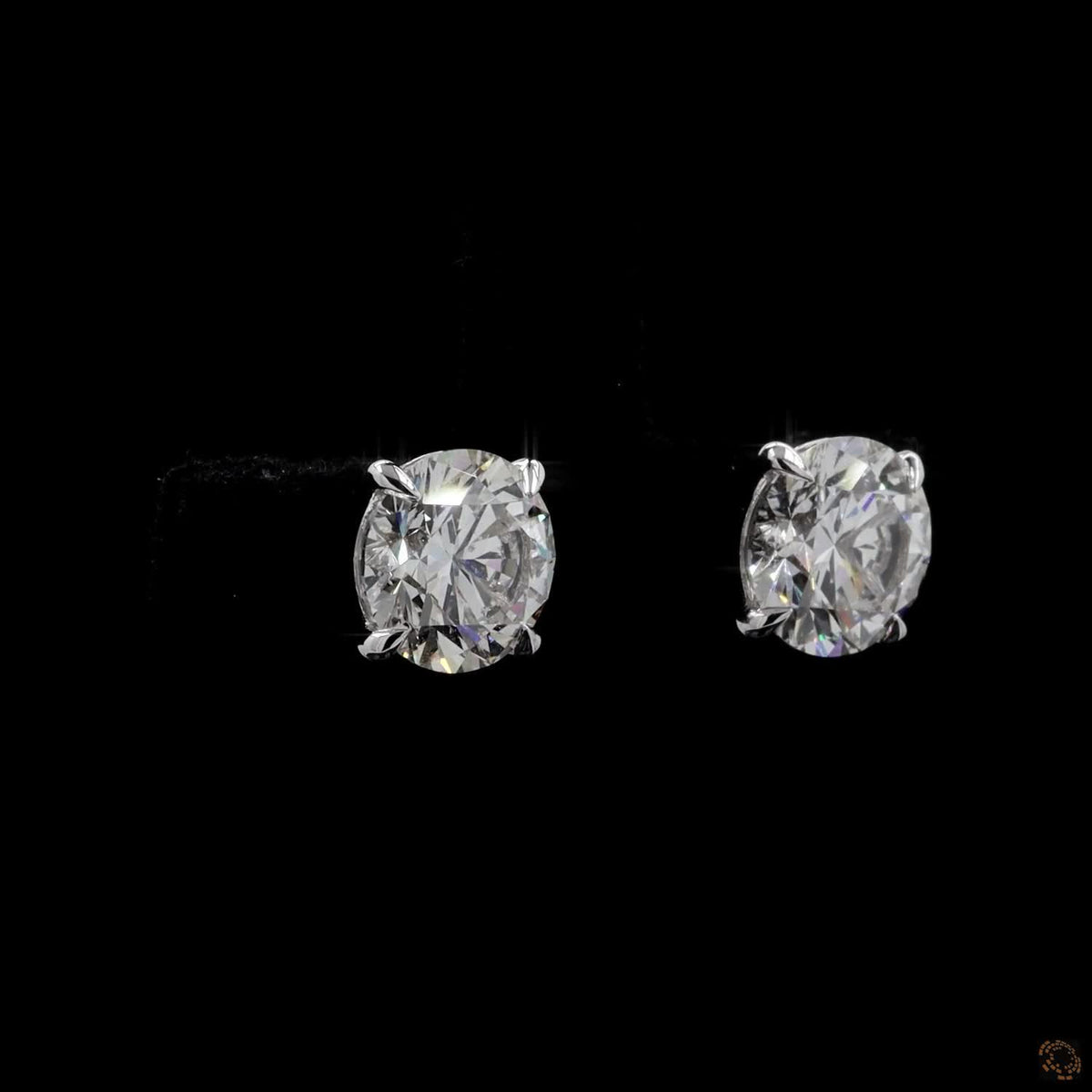 4.18 Ct Embrace quintessential elegance with these classic round brilliant-cut diamond solitaire stud earrings set in 14K white gold
