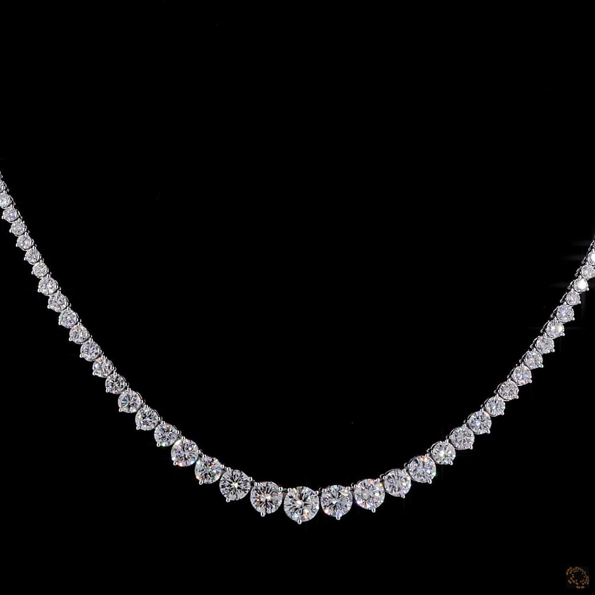 9.74 Ct Graduated stones range from subtle accent carats near the clasp to larger carat sizes along the center focal curve
