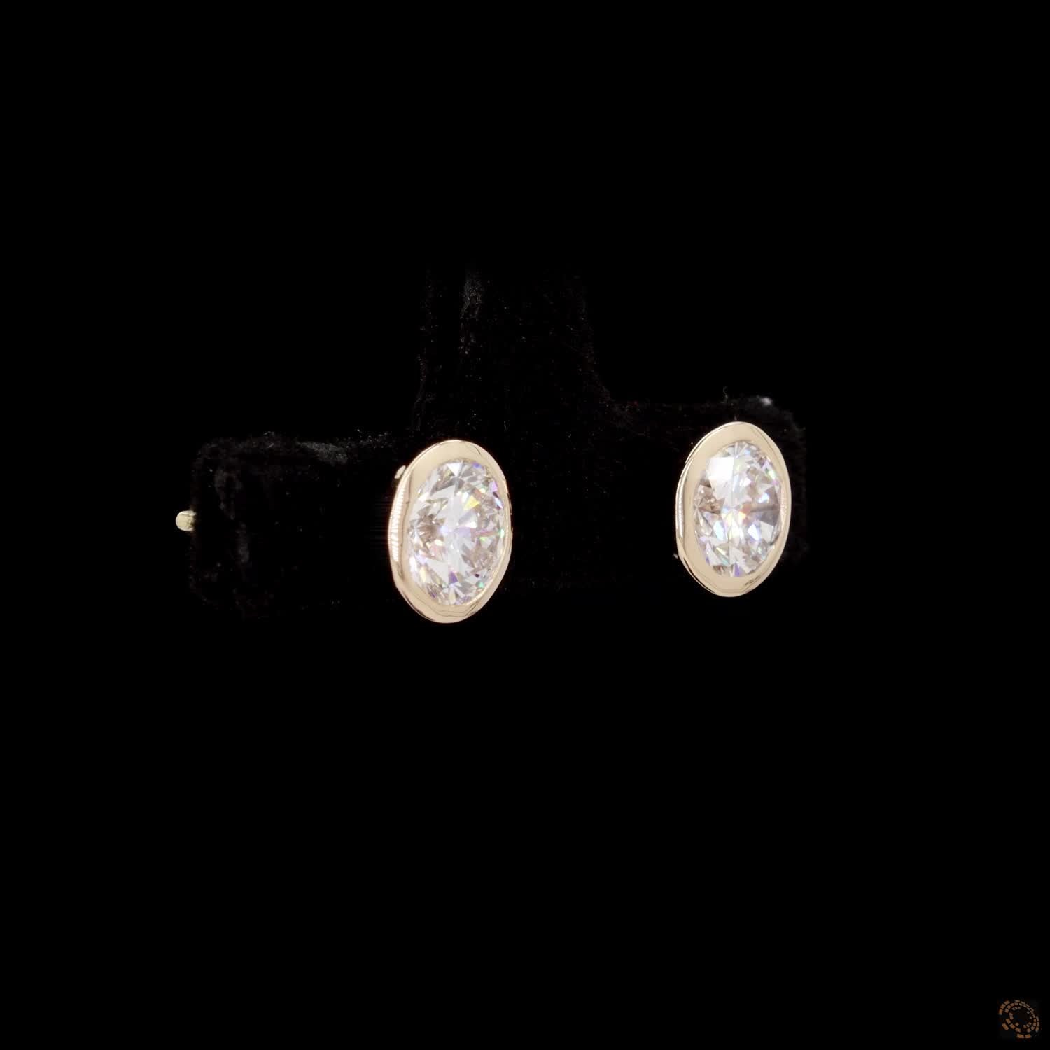 1.47 Bezel-Set Oval Cut Diamond Stud Earrings in Yellow Gold