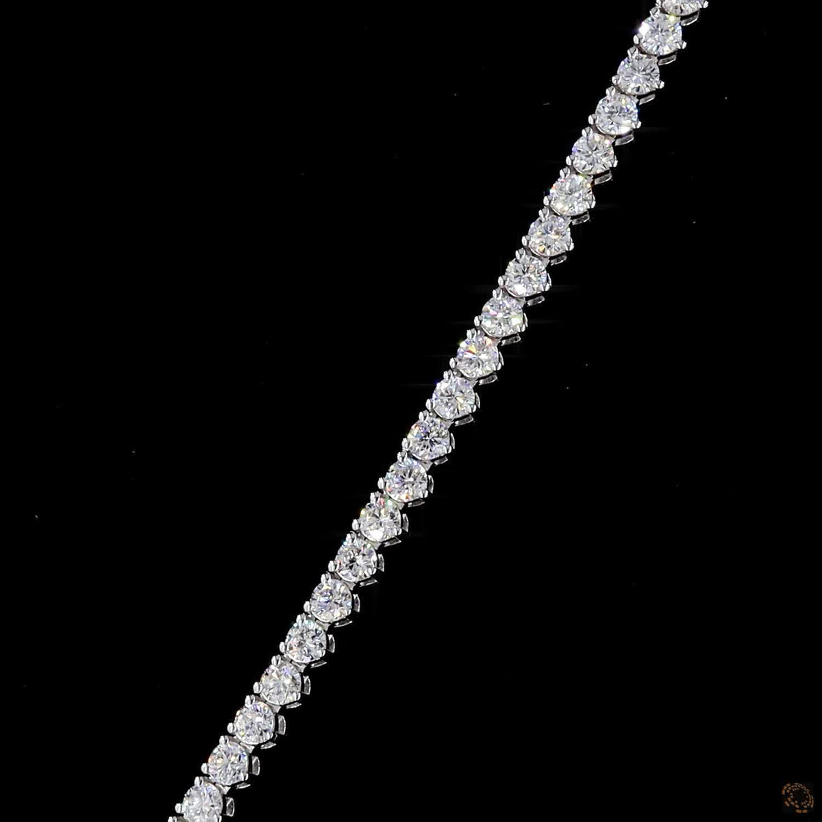 9.74 Ct Graduated stones range from subtle accent carats near the clasp to larger carat sizes along the center focal curve