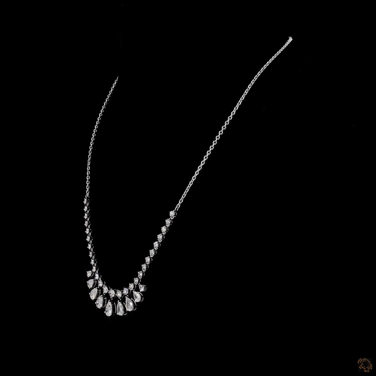6.34 Ct Elegant fringe-style station necklace with a central arc of suspended, articulated pear-cut diamond drops