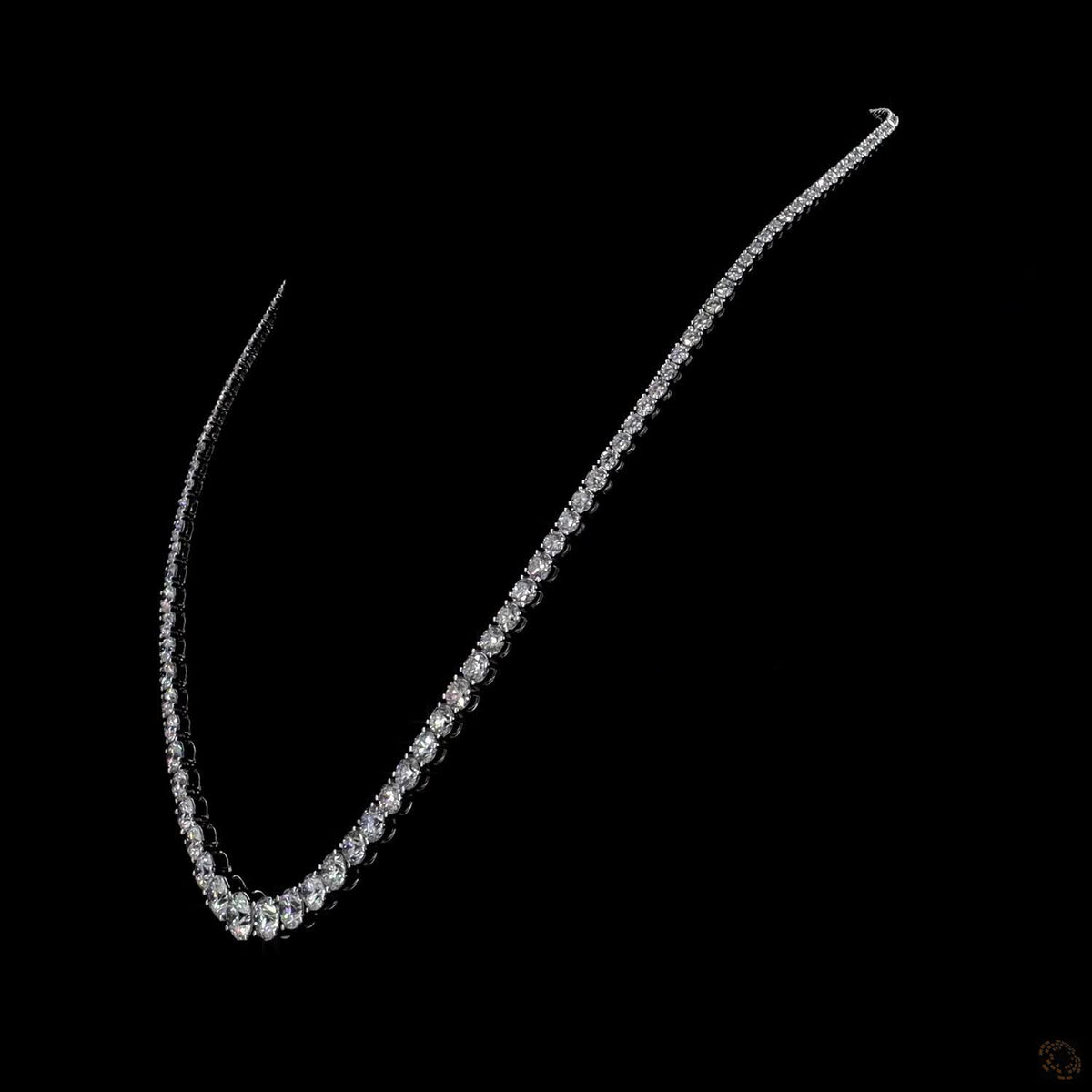 21.24 Ct Round Brilliant Cut diamonds arranged in a subtle, continuous graduated layout that tapers smoothly toward the back