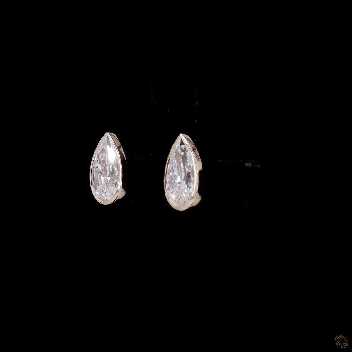 2.18 Ct Bezel-Set Pear Cut Diamond Stud Earrings in Yellow Gold