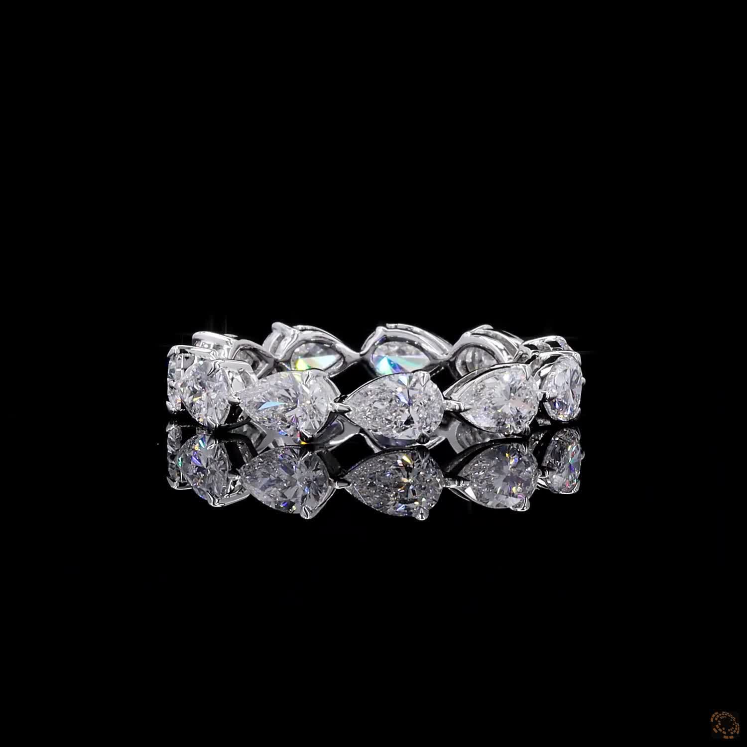 2.72 Ct Full eternity band featuring horizontally set East-West style pear-cut diamonds connected in an alternating head-to-tail arrangement