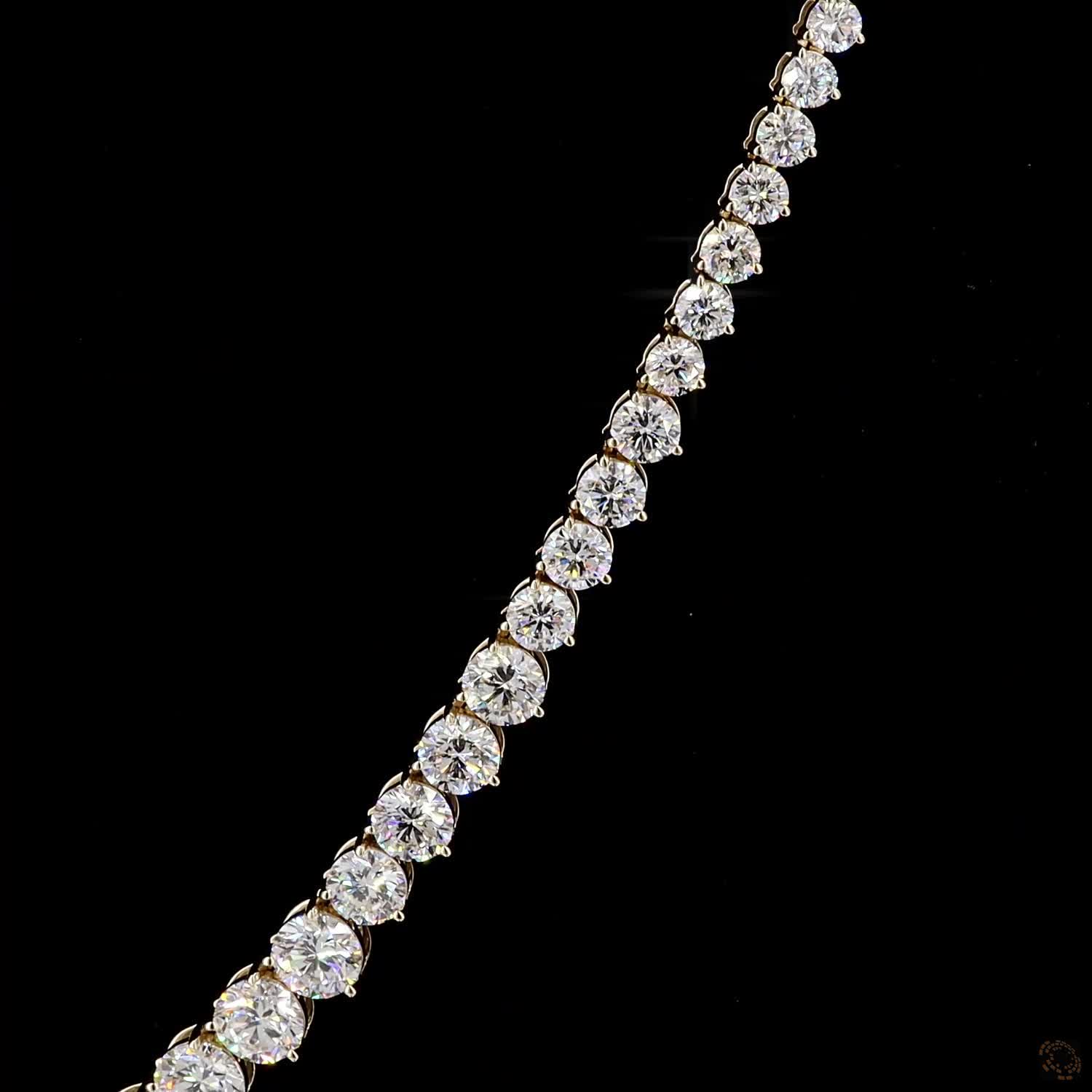 29.06 Ct Round Brilliant Cut diamonds seamlessly graduated from larger center stones down to smaller accent diamonds toward the back