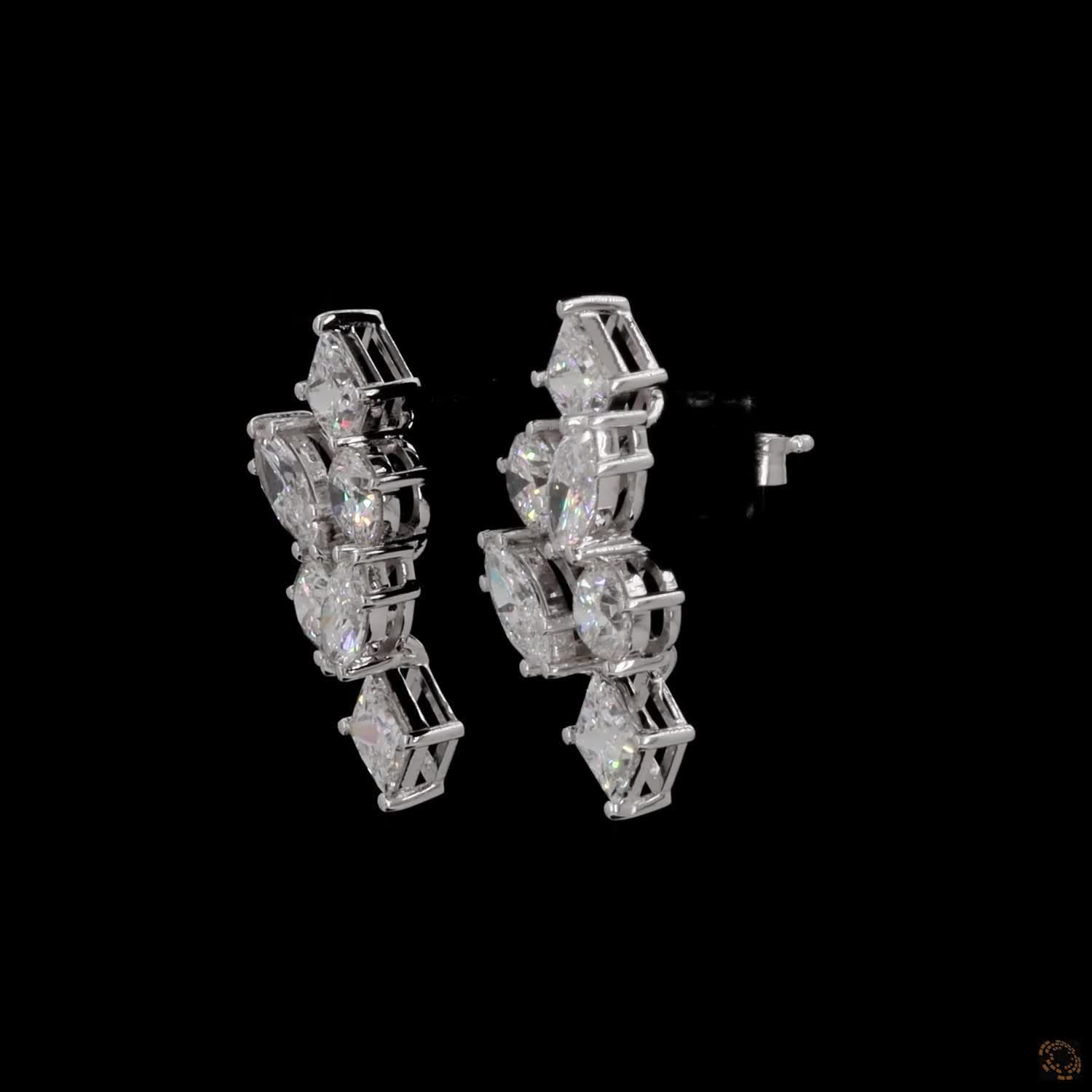 5.6 Ct Vertical cascading cluster capped at the top and bottom by kite-set princess-cut diamonds, sandwiching an alternating pattern of marquise and round brilliant stones