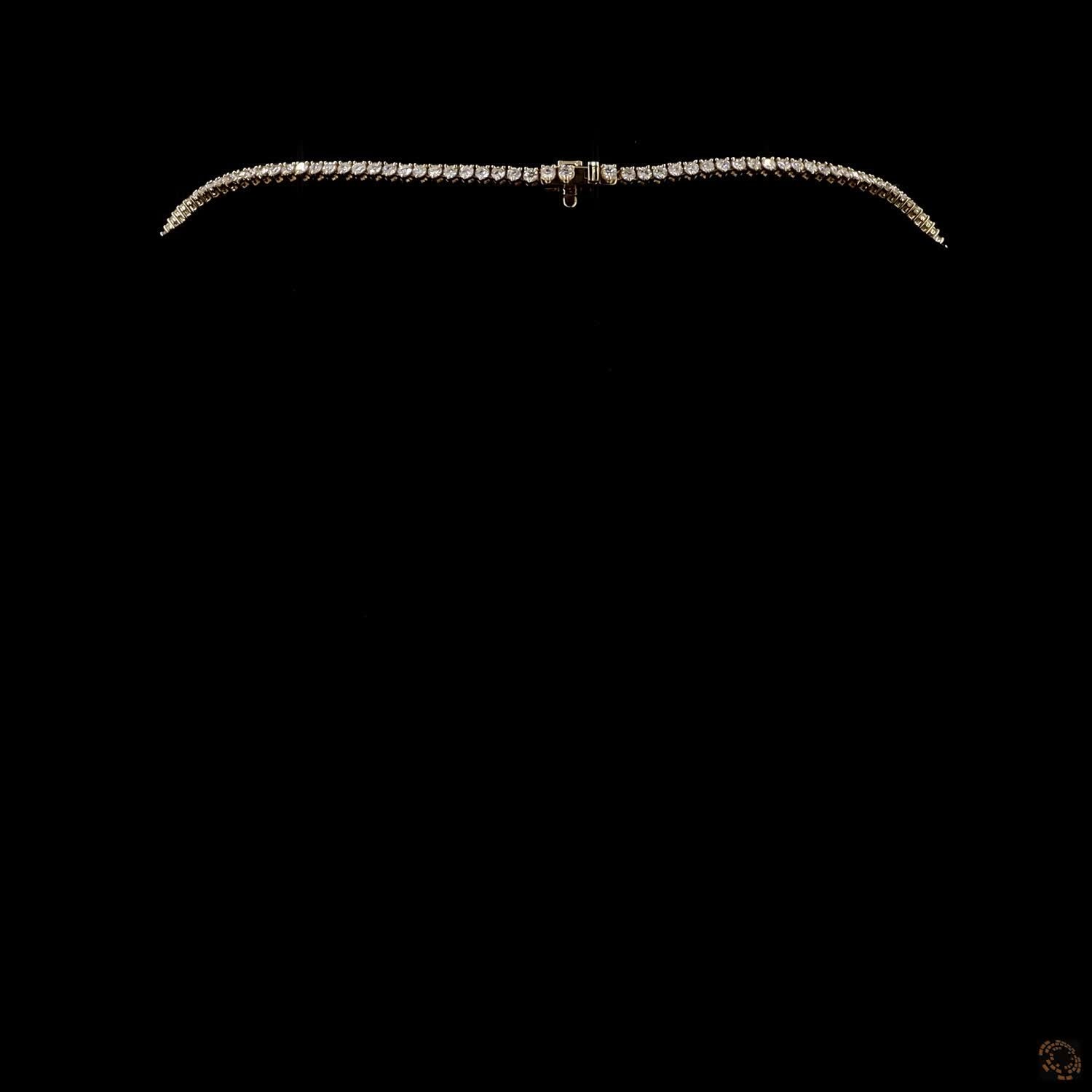 16.21 Ct Traditional Riviera-style tennis necklace defined by a smooth, proportional graduation of diamonds ending in a prominent center stone