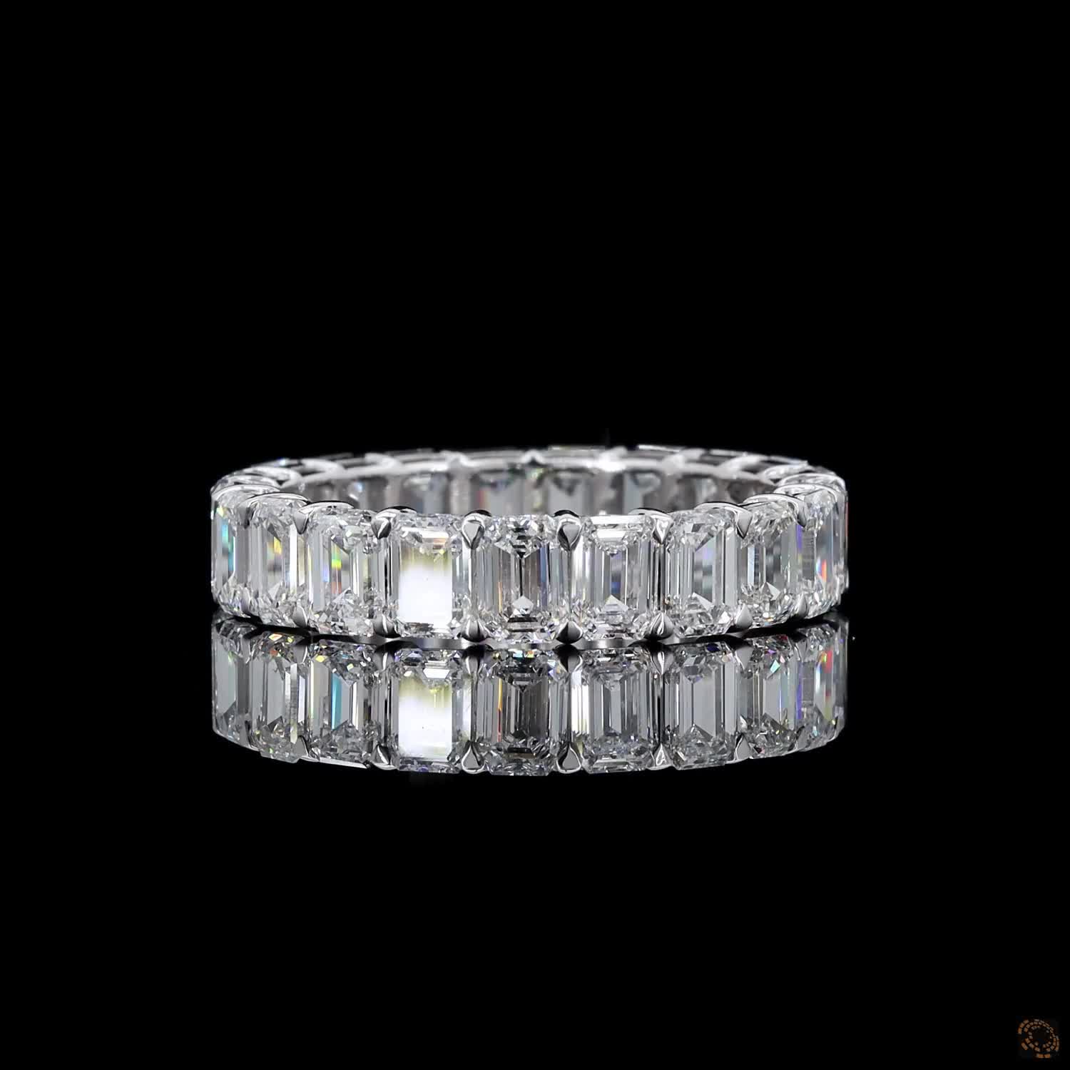 5.39 Ct Step-cut Emerald Diamonds continuously set around the full band