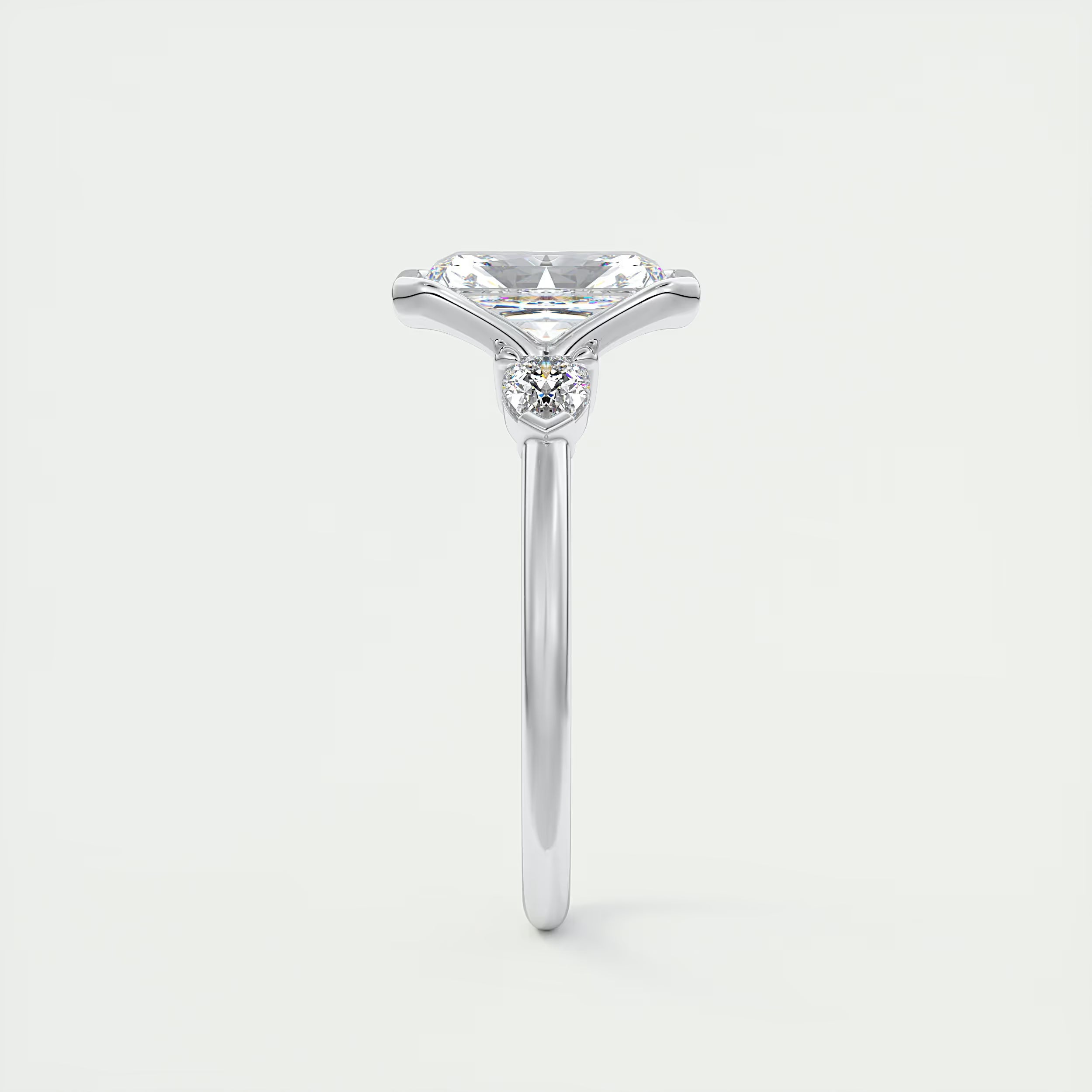 2.50 Ct Clutch Radiant & Pear Three Stone Engagement Rings