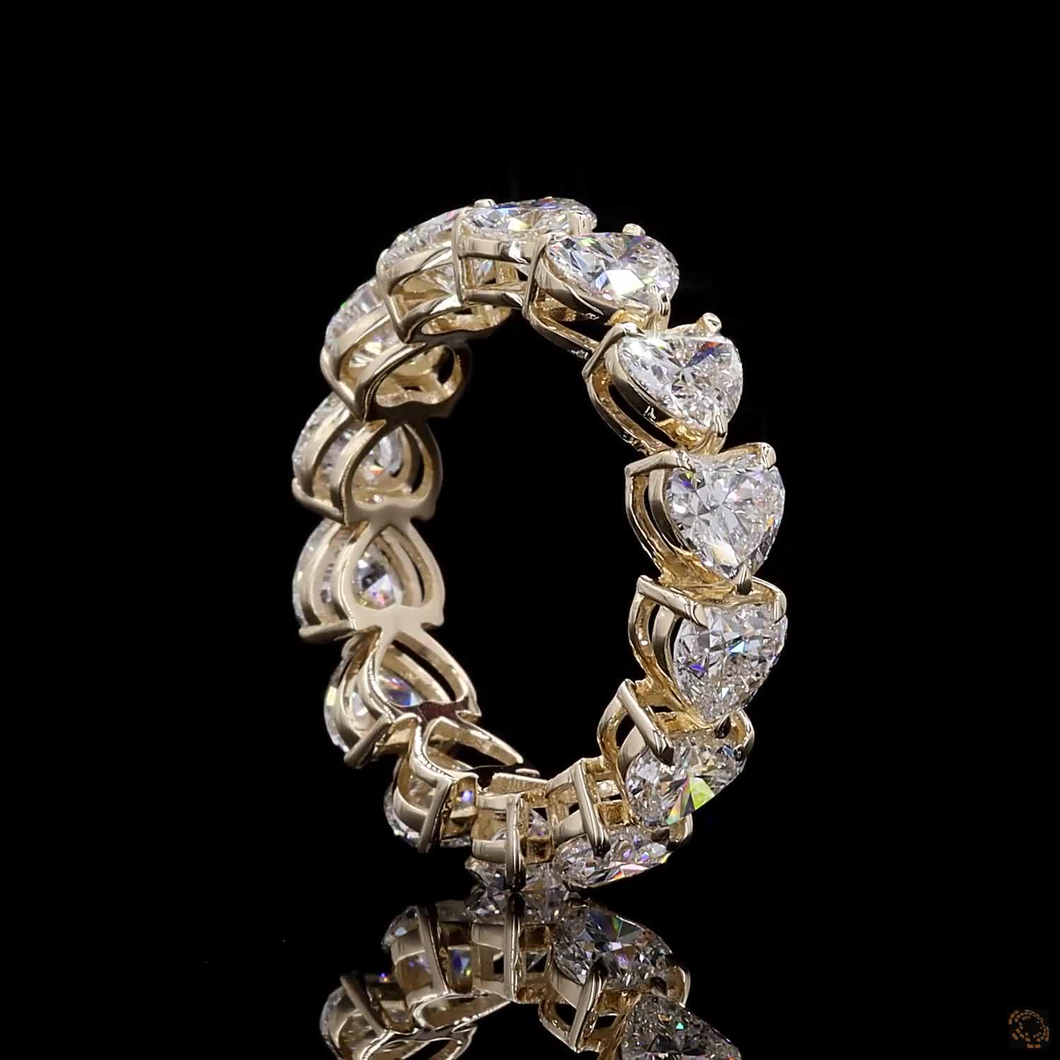 5.44 Ct Full eternity band featuring a continuous row of horizontally aligned east-west oriented heart-cut diamonds seamless set end-to-end around the entire band