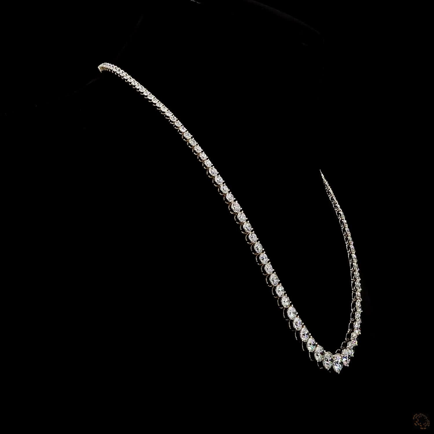 17.79 Ct Round Brilliant Cut diamonds arranged in a dramatic graduated layout tapering toward the back