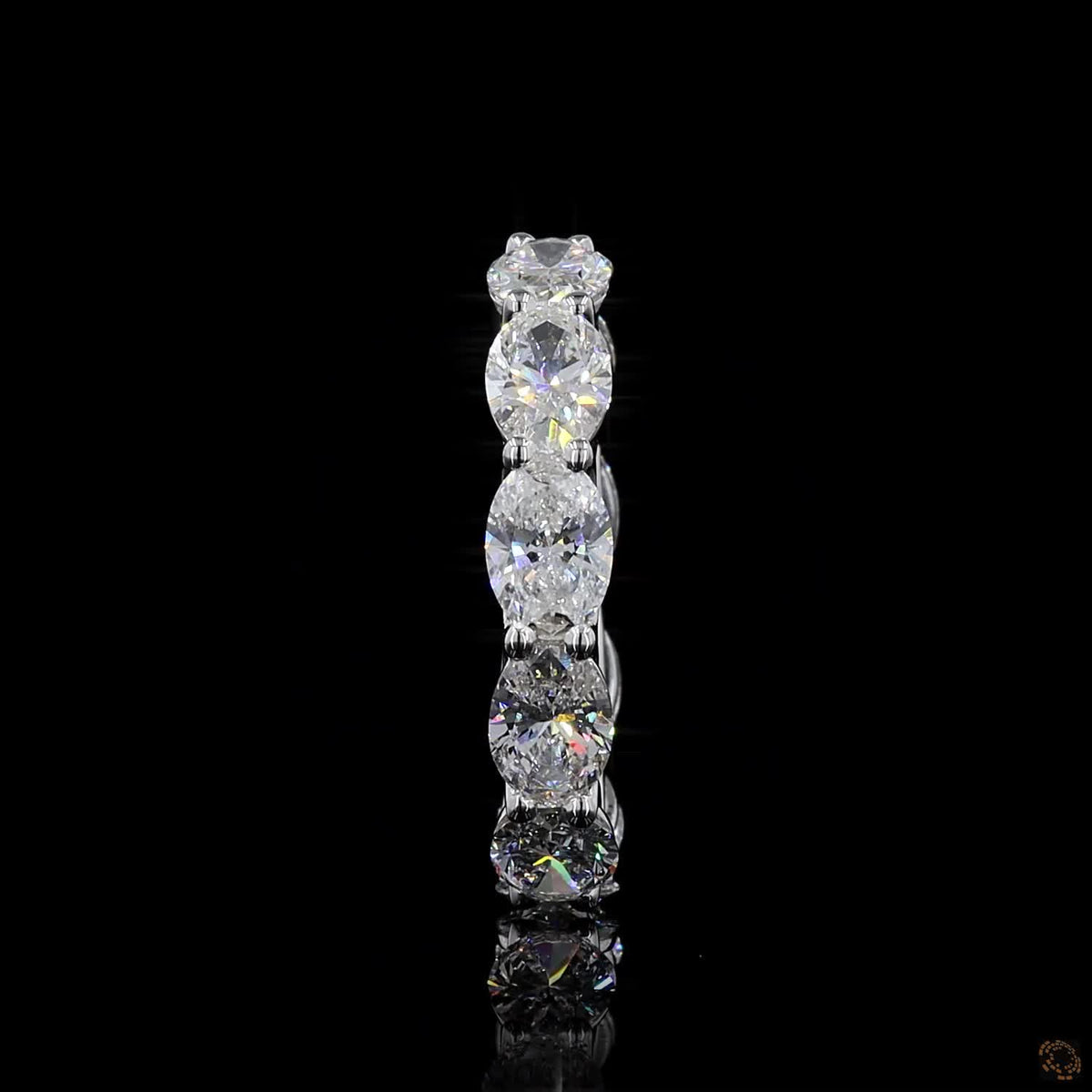 5.31 Ct East-West Oval Cut Diamond Eternity Band set in white gold or platinum with horizontally aligned oval stones and a scalloped open-basket profile