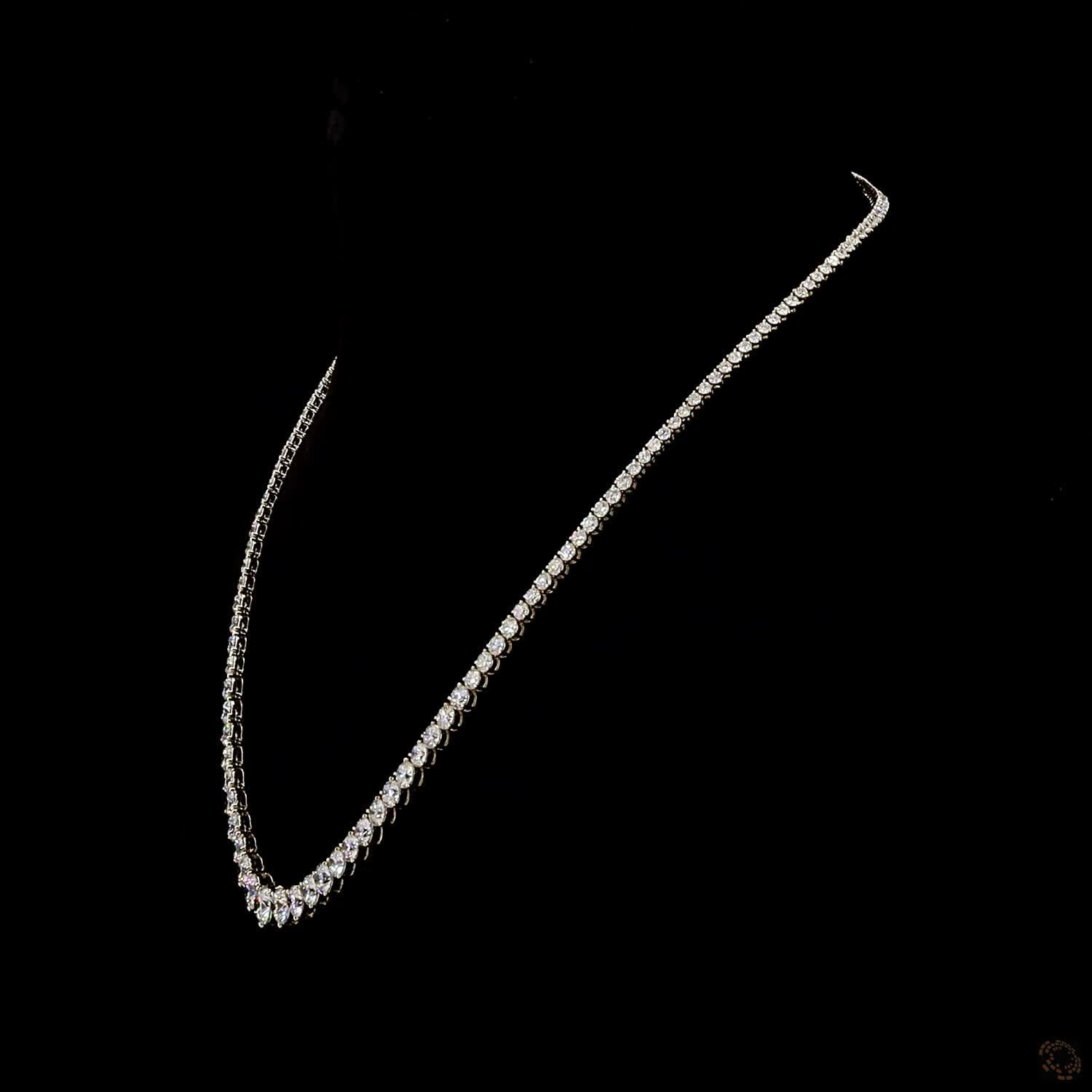 29.06 Ct Round Brilliant Cut diamonds seamlessly graduated from larger center stones down to smaller accent diamonds toward the back