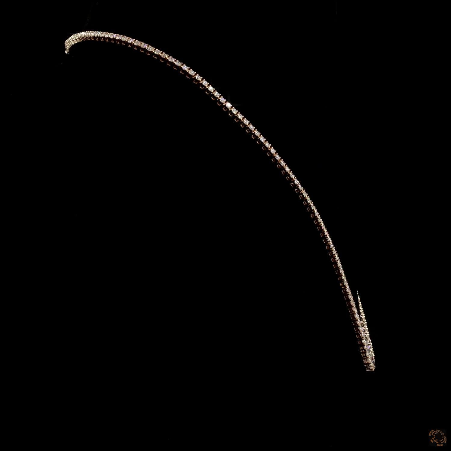 9.7 Ct Riviera-style tennis necklace featuring a smooth, symmetrical graduation of round brilliant diamonds leading to a central focal point