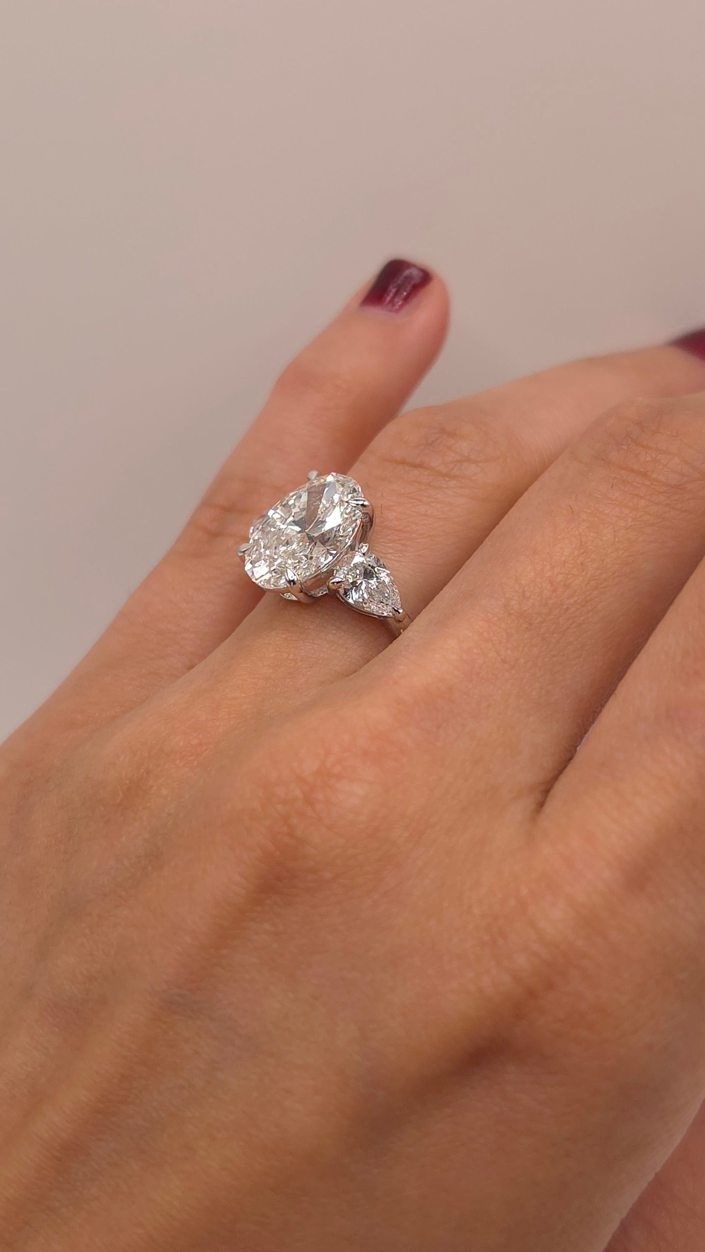 4.49 Ct Luxury Oval Solitaire Ring with Pear Side Stones