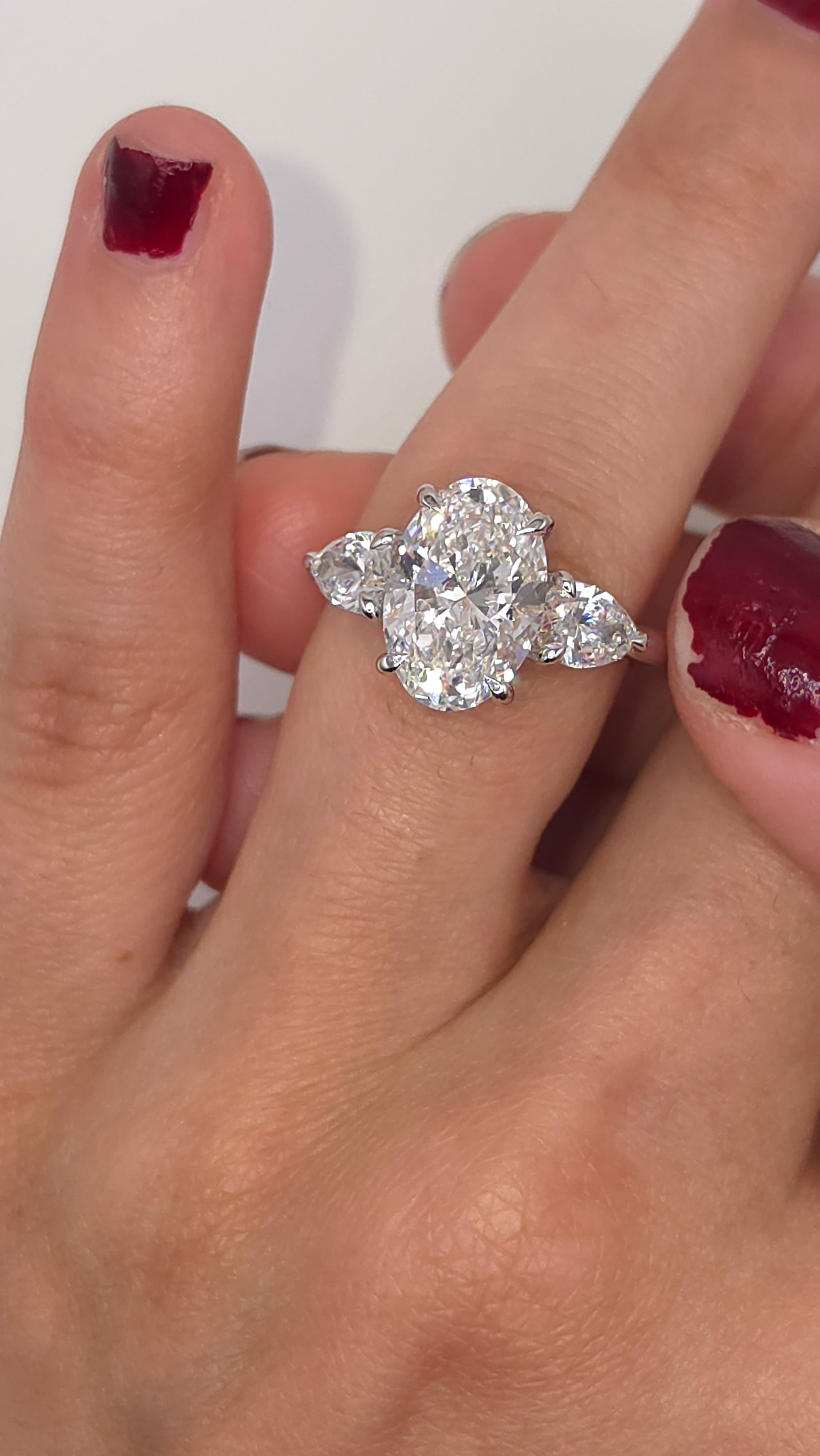 4.49 Ct Luxury Oval Solitaire Ring with Pear Side Stones