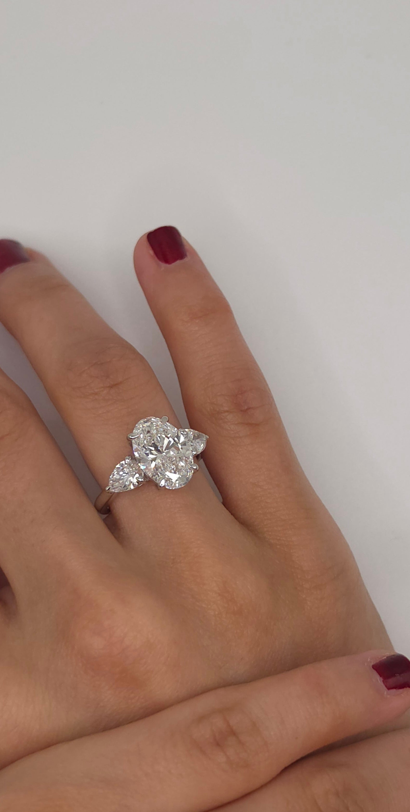 4.49 Ct Luxury Oval Solitaire Ring with Pear Side Stones