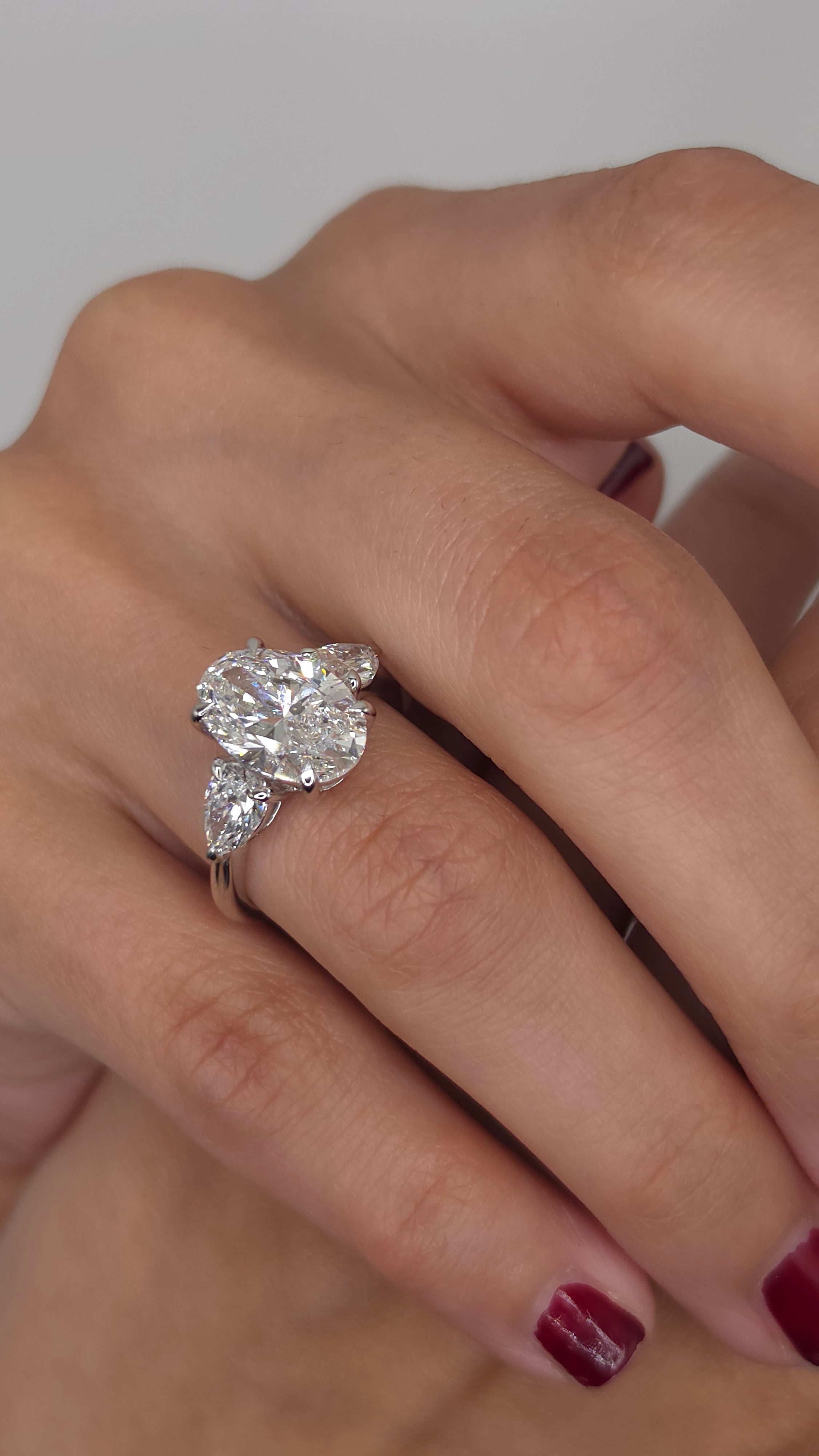 4.49 Ct Luxury Oval Solitaire Ring with Pear Side Stones