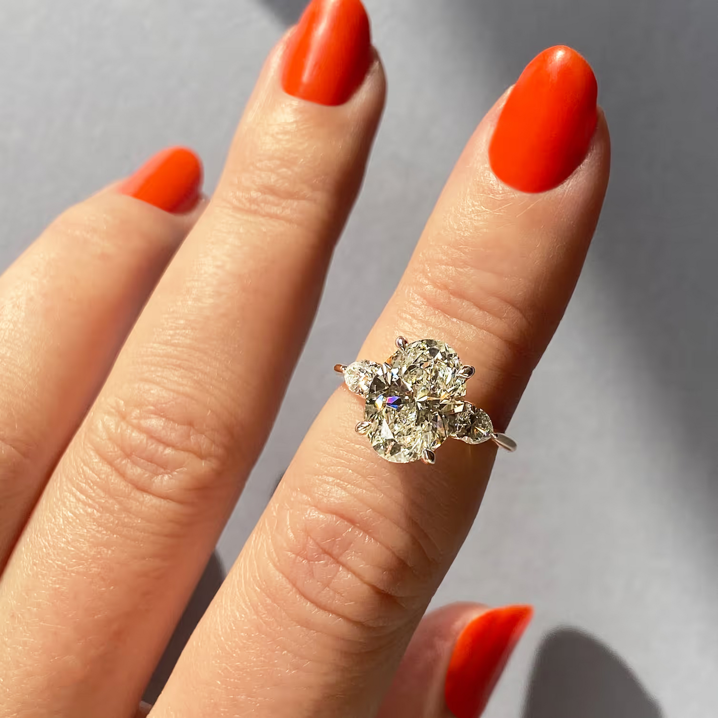 2.50 Ct Breezy Pears Oval Solitaire Side Stone Rings