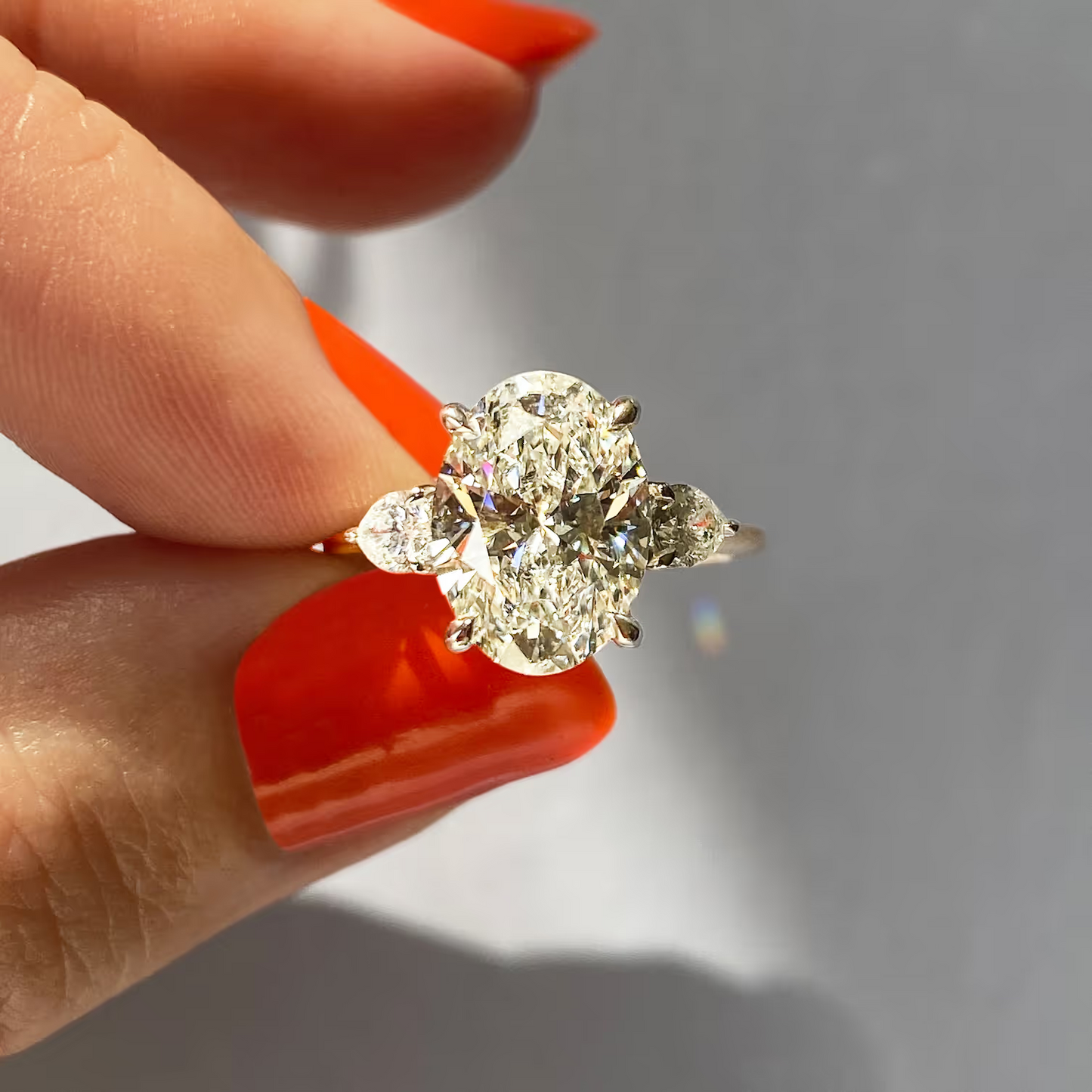 2.50 Ct Breezy Pears Oval Solitaire Side Stone Rings