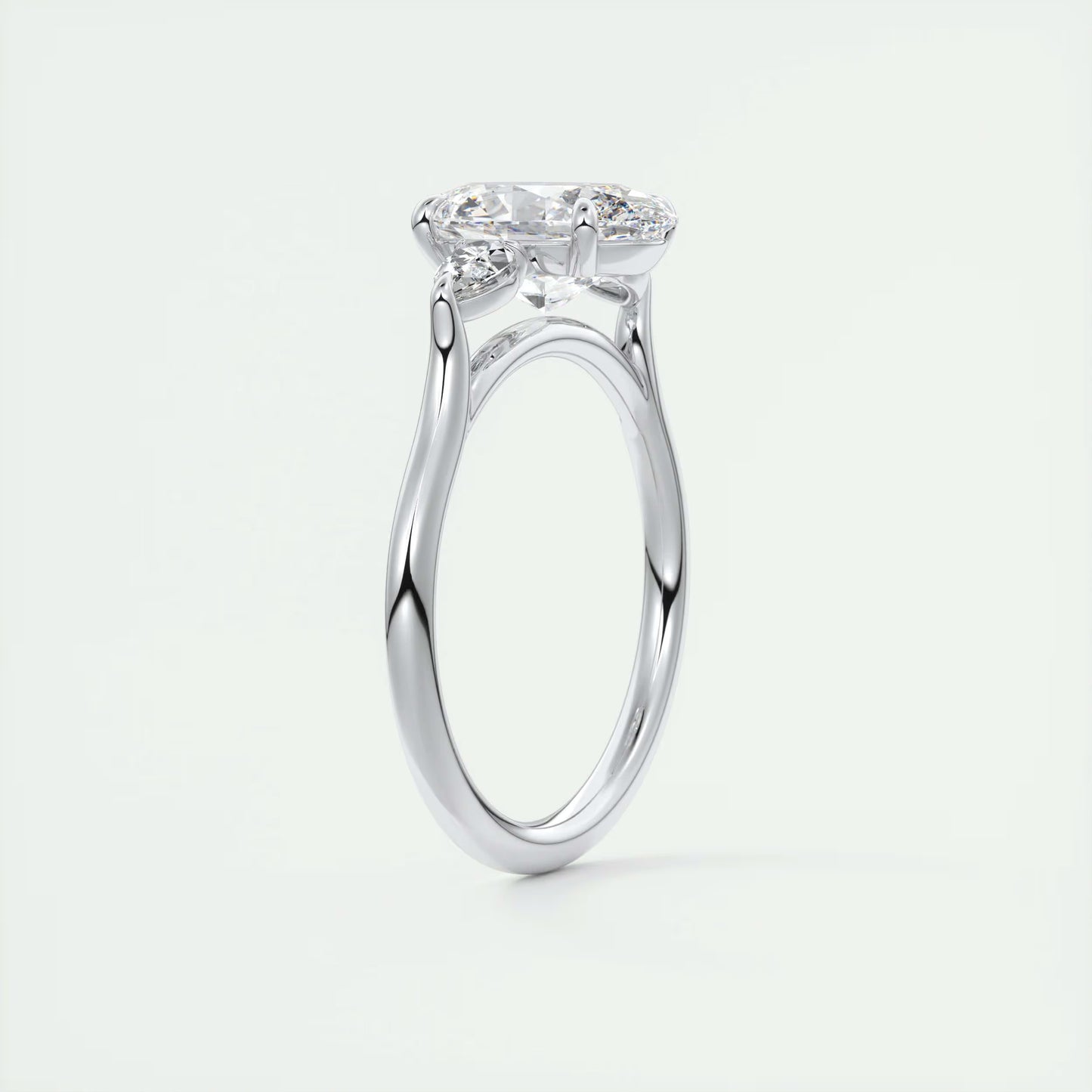 2.50 Ct Breezy Pears Oval Solitaire Side Stone Rings