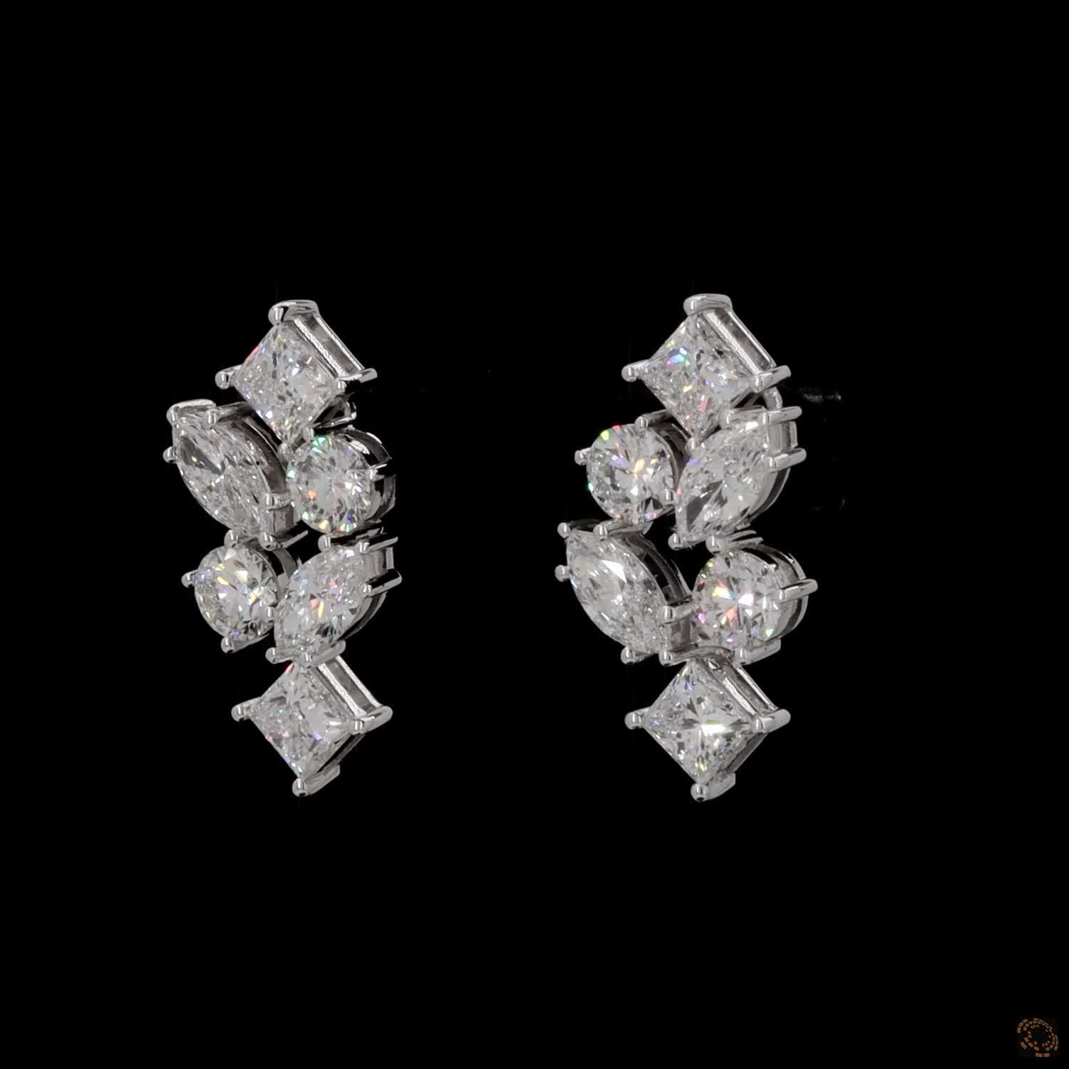 5.6 Ct Vertical cascading cluster capped at the top and bottom by kite-set princess-cut diamonds, sandwiching an alternating pattern of marquise and round brilliant stones