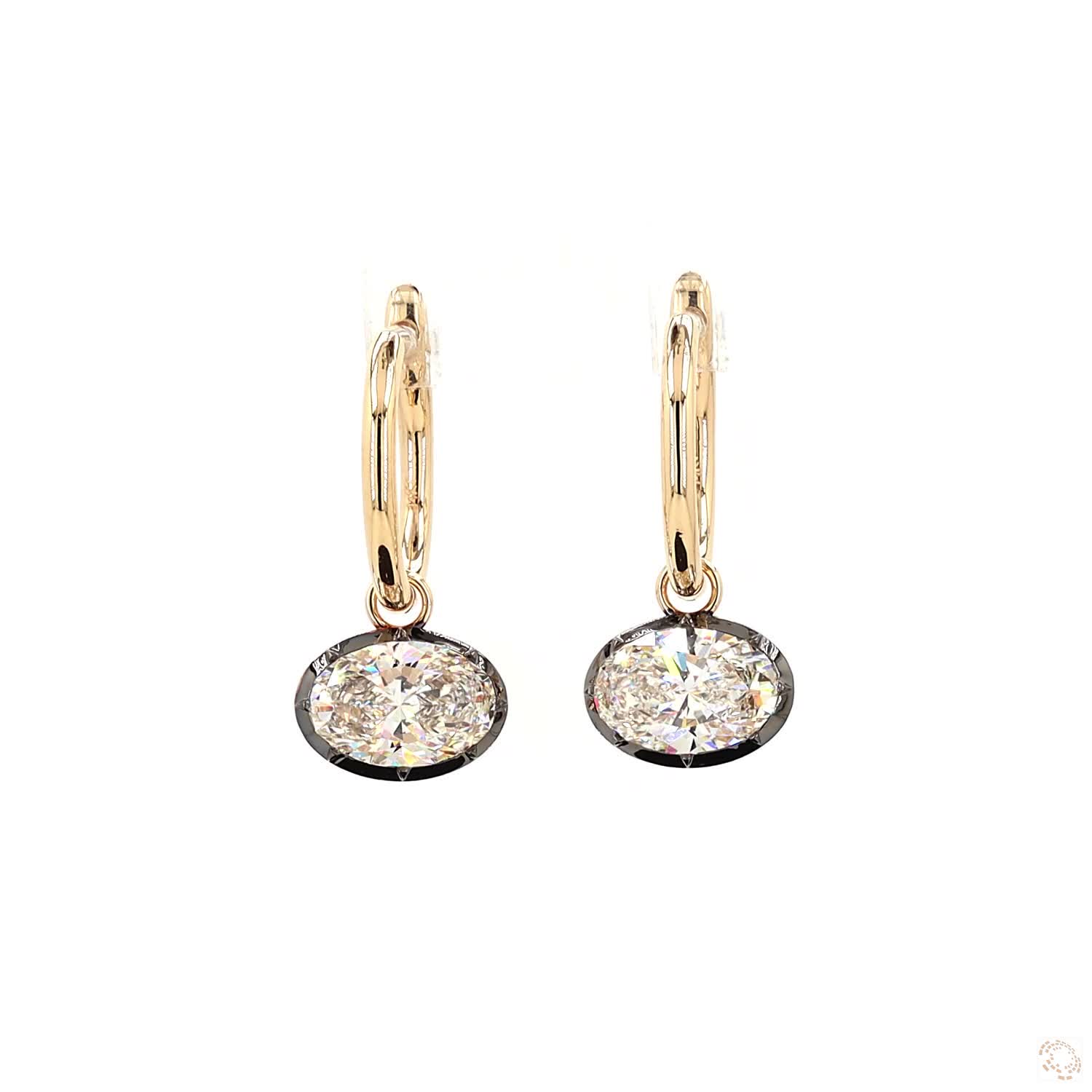 4.27 Ct Brilliant Oval Cut solitaire stone set horizontally in a sleek East-West orientation within a dark-finished, contrast bezel rim