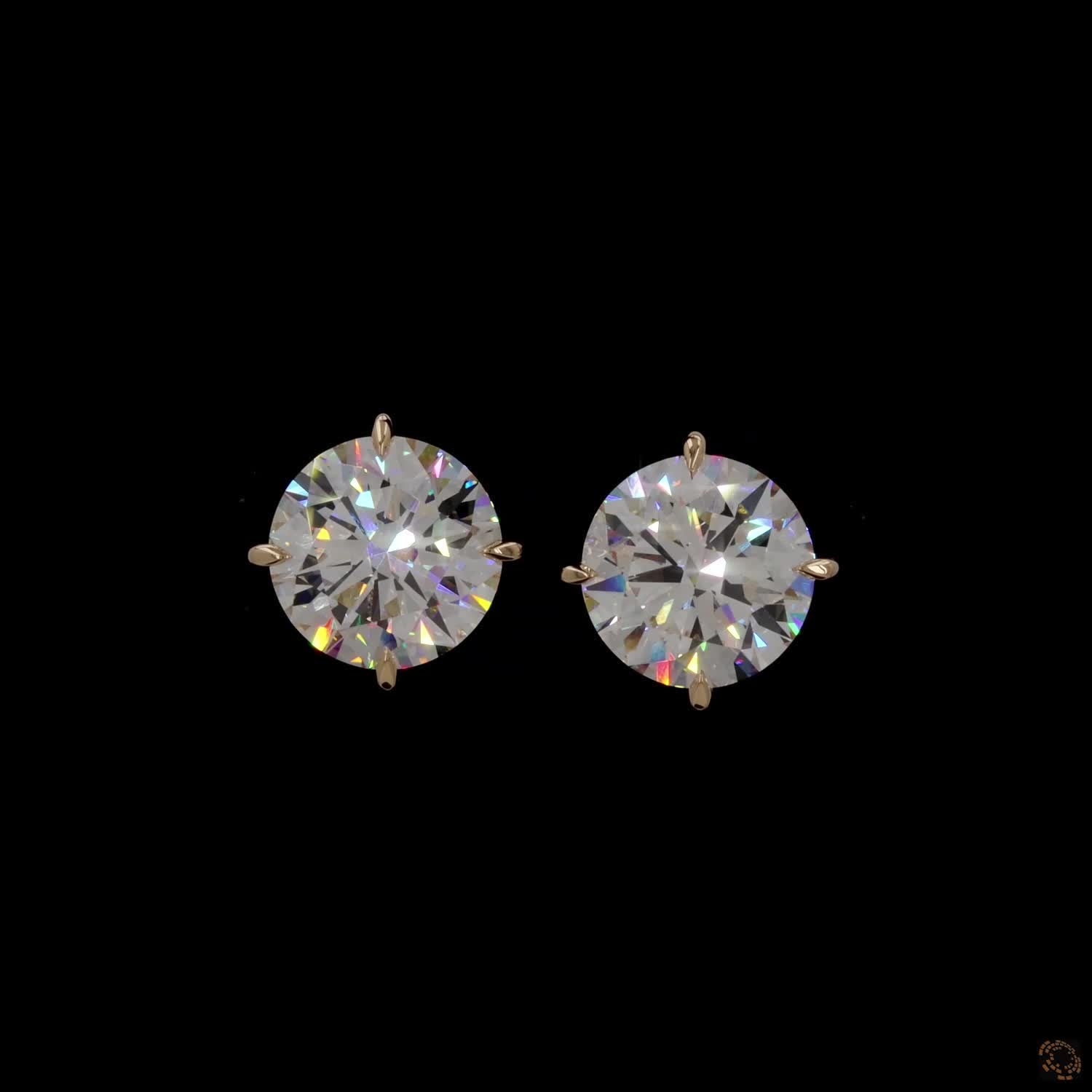 12.07 Ct Minimalist single-stone solitaire studs set in a delicate, architectural basket mount