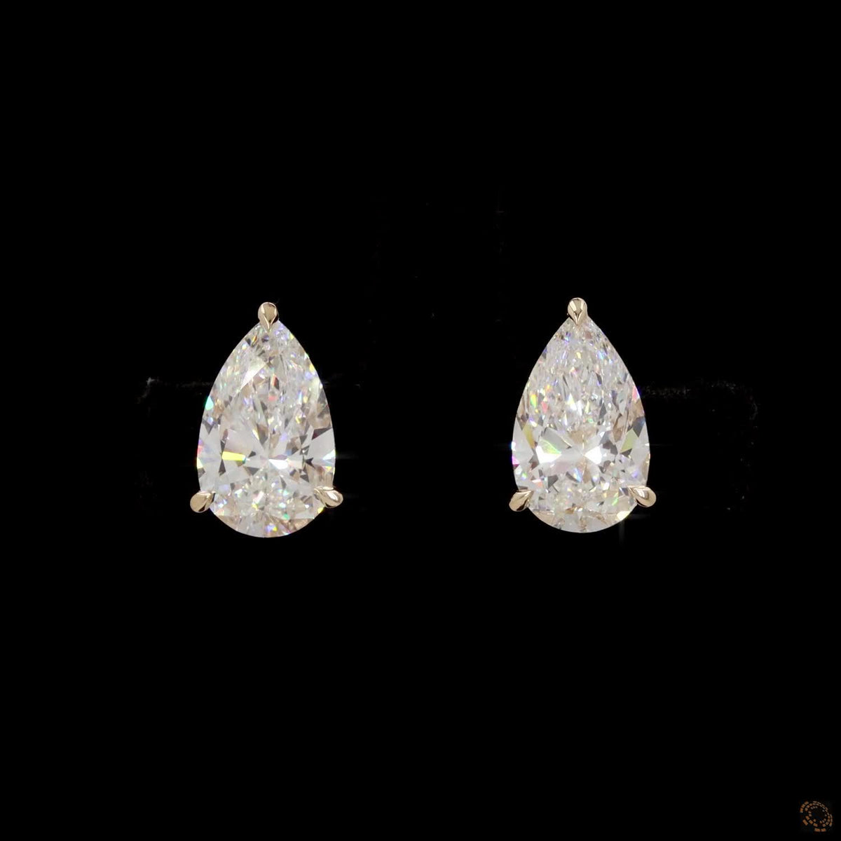 4.00 Ct Three-Prong Pear Cut Diamond Stud Earrings in Yellow Gold