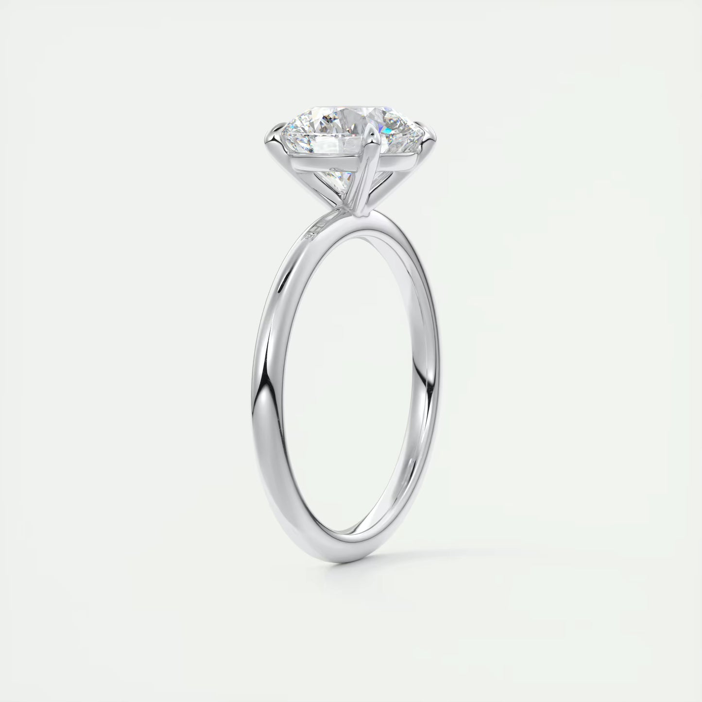 4-5 GM Round Solitaire with Four Eagle Claws Set Engagement Ring