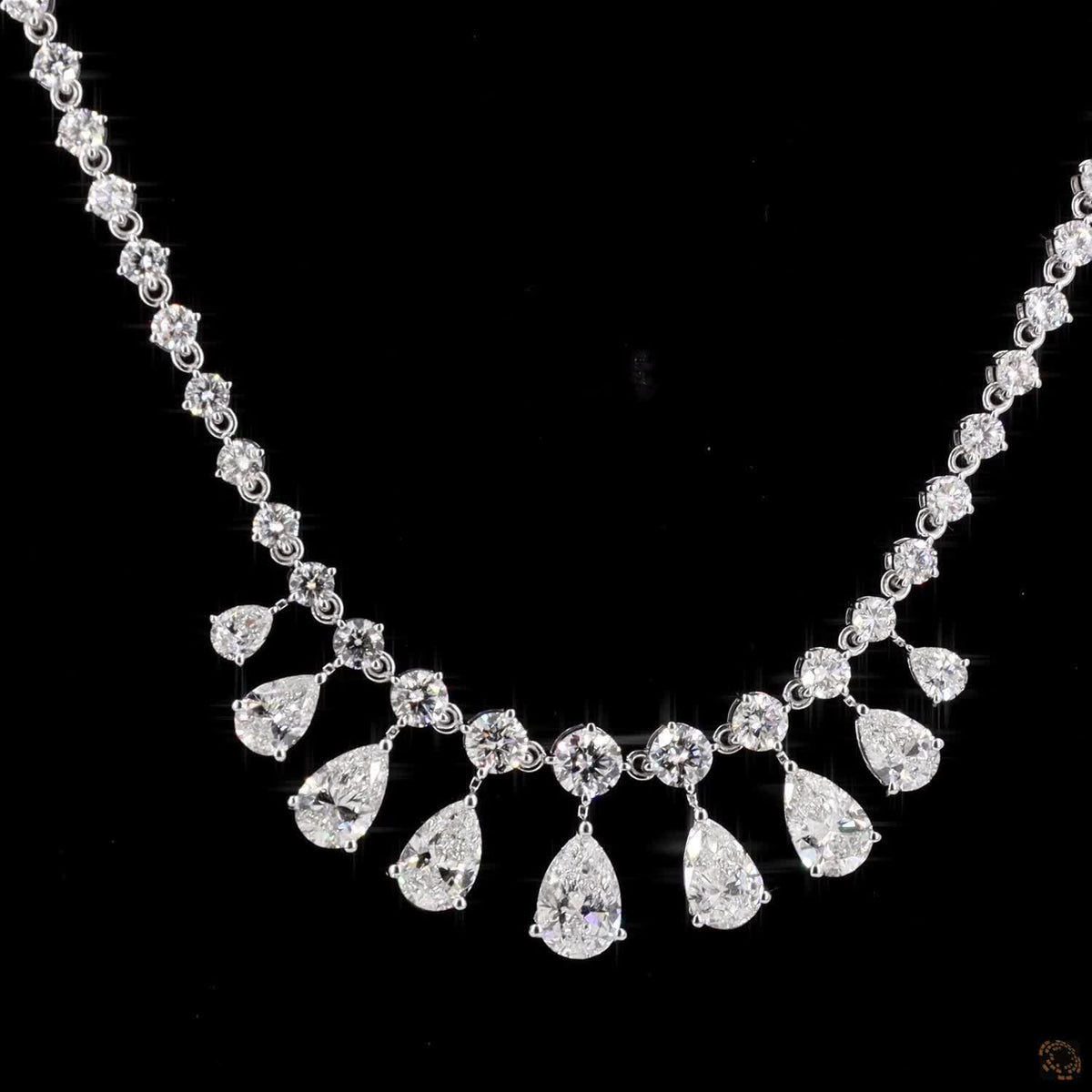 6.34 Ct Elegant fringe-style station necklace with a central arc of suspended, articulated pear-cut diamond drops