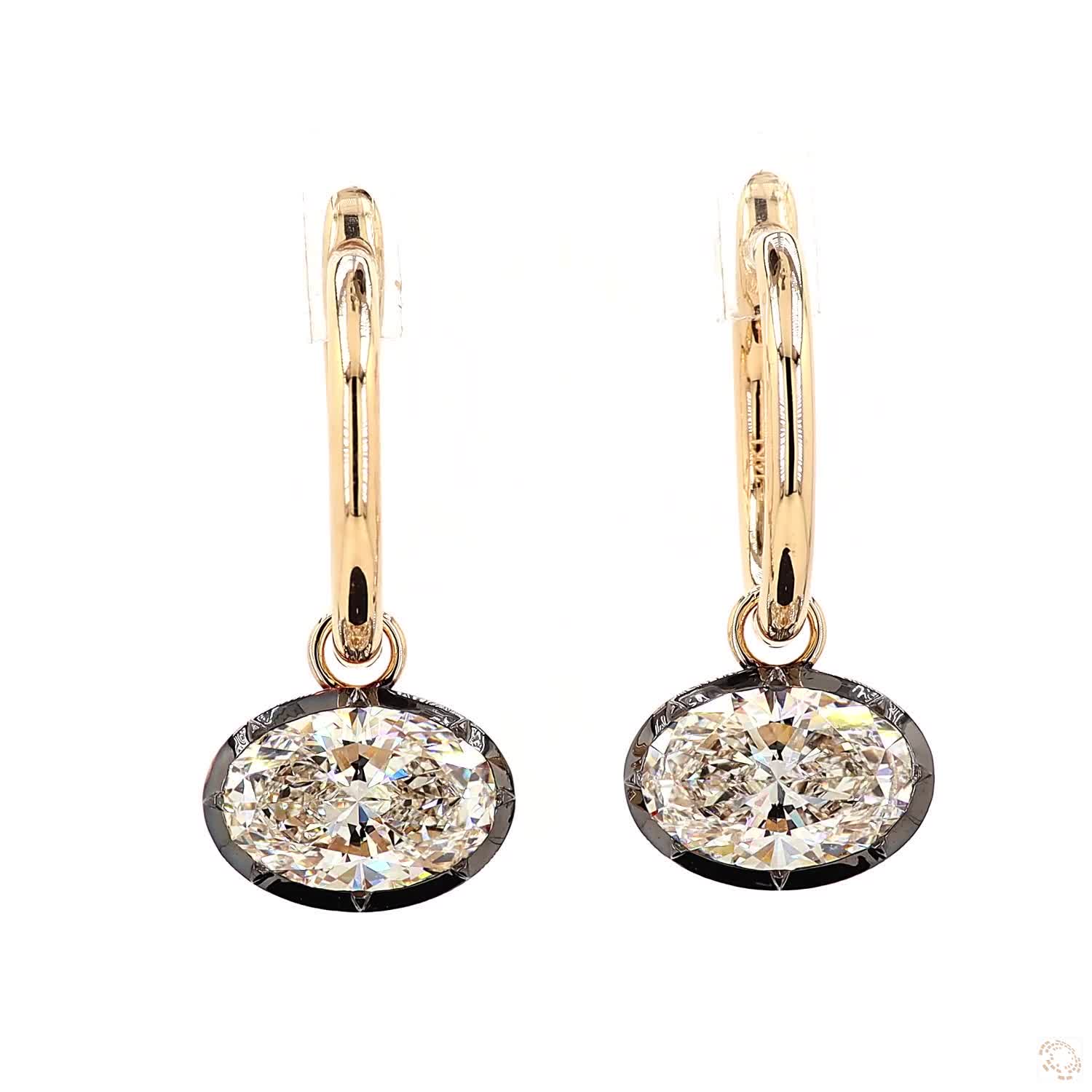 4.27 Ct Brilliant Oval Cut solitaire stone set horizontally in a sleek East-West orientation within a dark-finished, contrast bezel rim