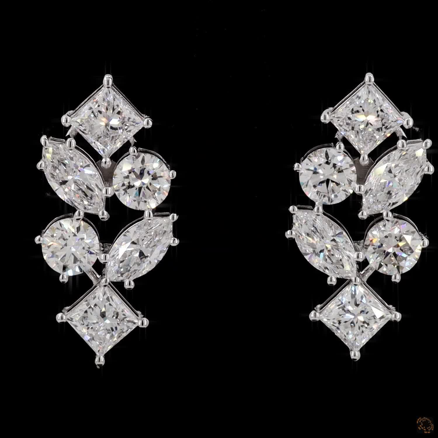 5.6 Ct Vertical cascading cluster capped at the top and bottom by kite-set princess-cut diamonds, sandwiching an alternating pattern of marquise and round brilliant stones