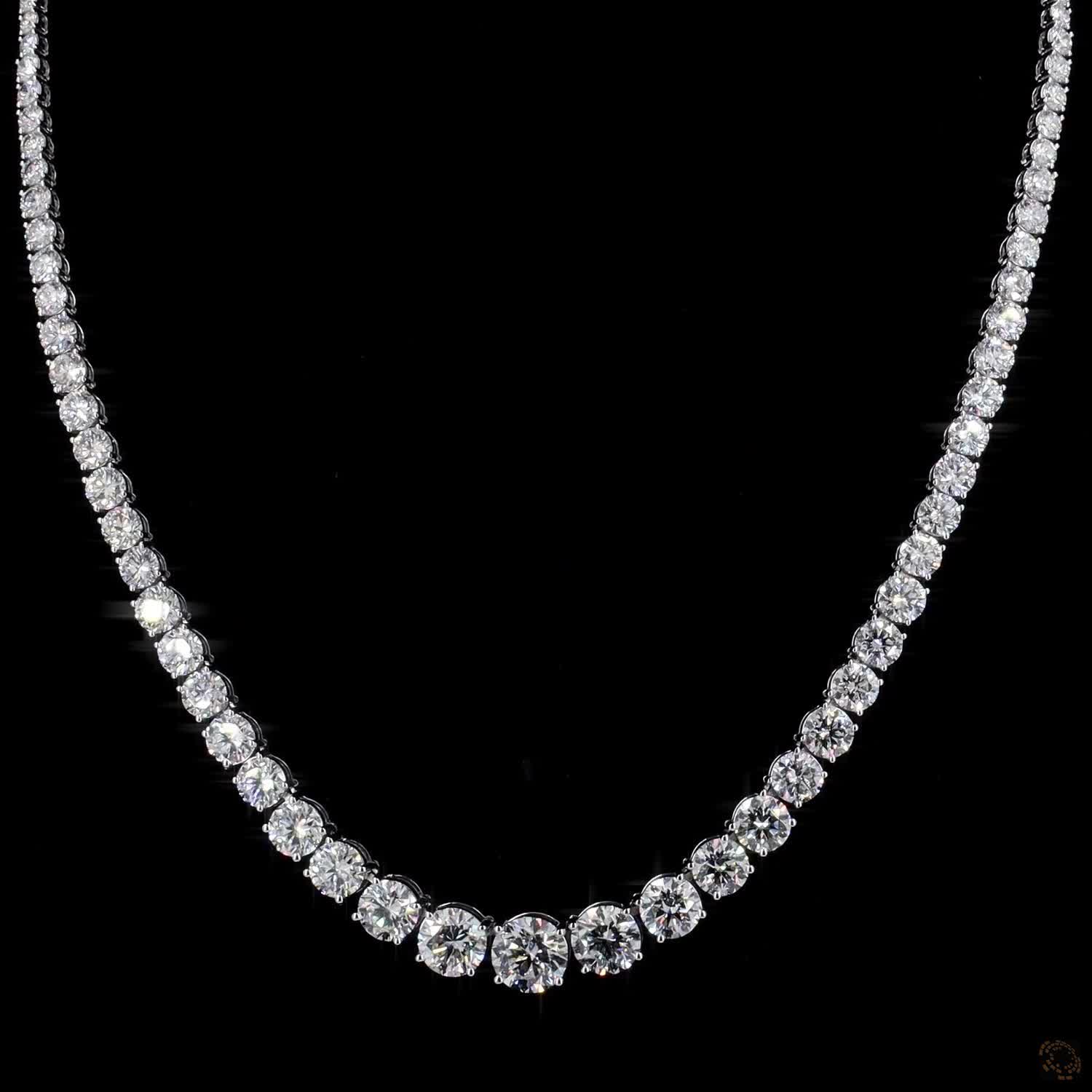 29.02 Ct Round Brilliant Cut diamonds seamlessly graduated from prominent center stones down to smaller accent stones toward the clasp