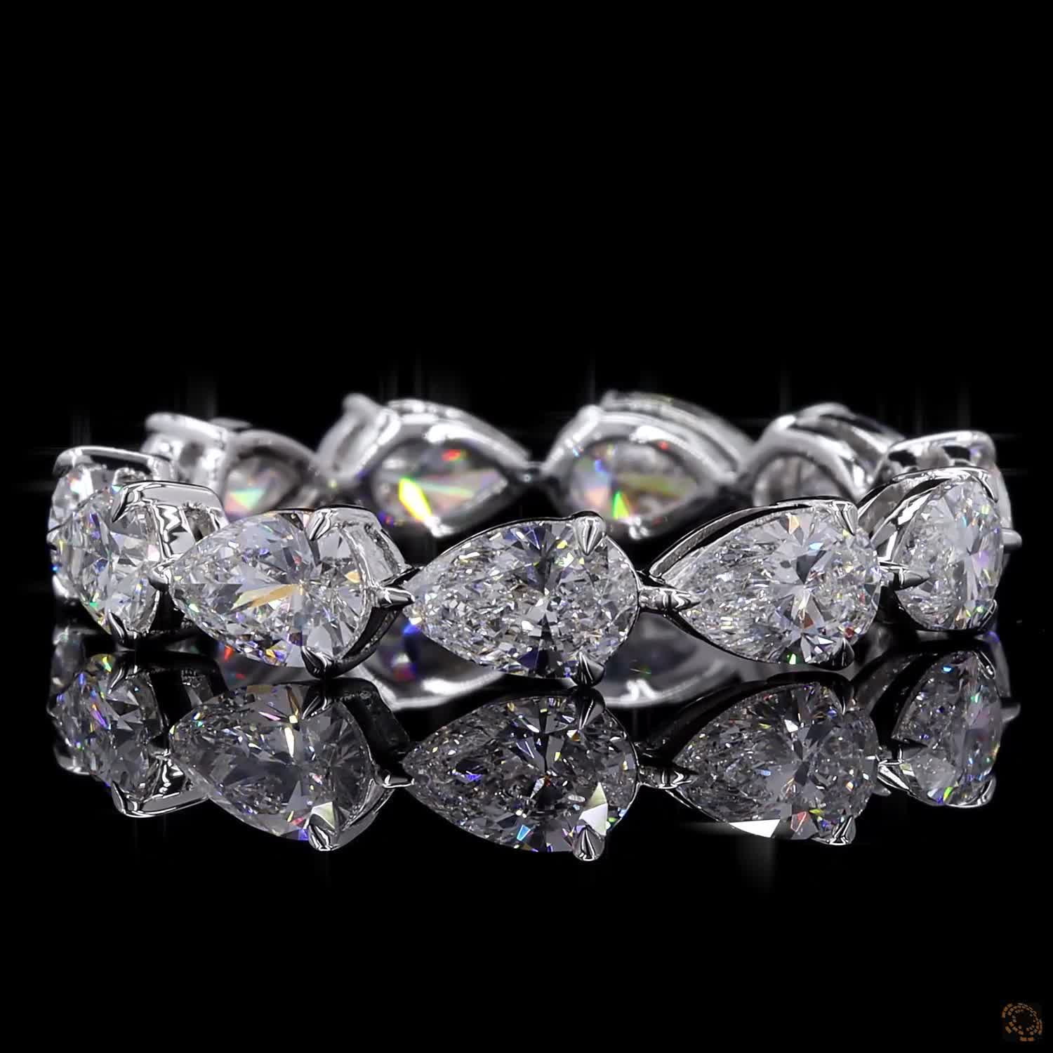 2.72 Ct Full eternity band featuring horizontally set East-West style pear-cut diamonds connected in an alternating head-to-tail arrangement