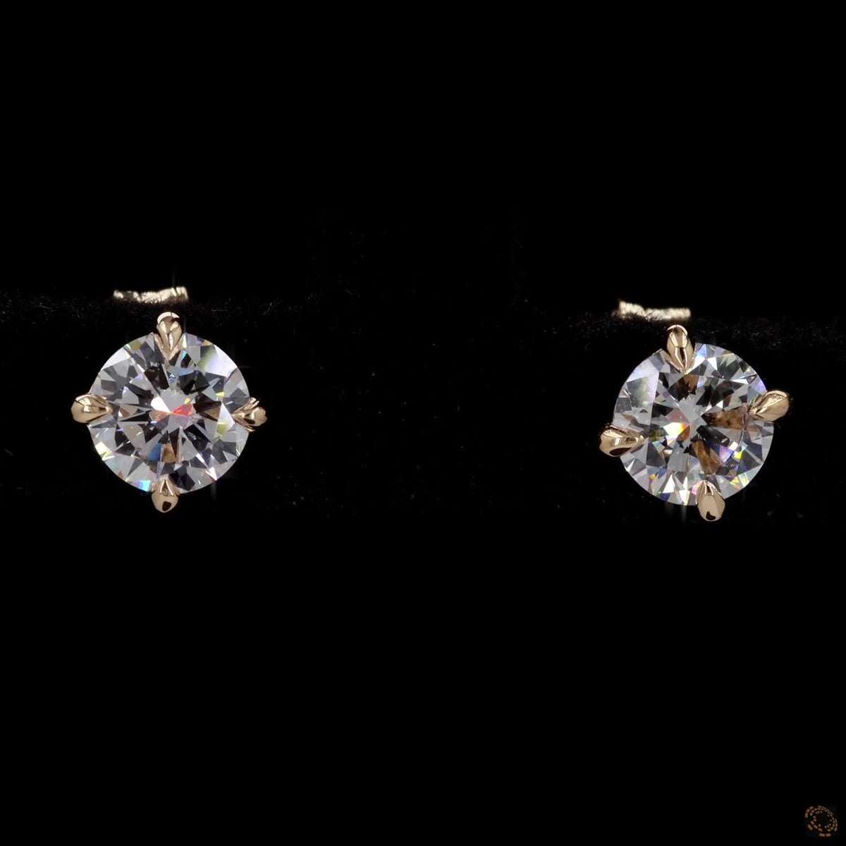 1.01 Ct Shop classic round brilliant solitaire diamond stud earrings set in 4-prong yellow gold basket settings with comfortable friction push-back closures