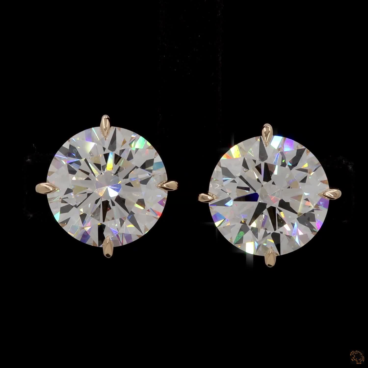 12.07 Ct Minimalist single-stone solitaire studs set in a delicate, architectural basket mount