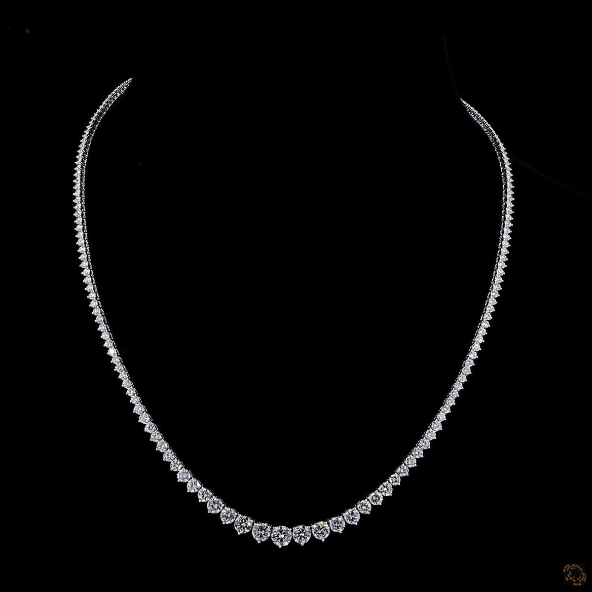 9.74 Ct Graduated stones range from subtle accent carats near the clasp to larger carat sizes along the center focal curve