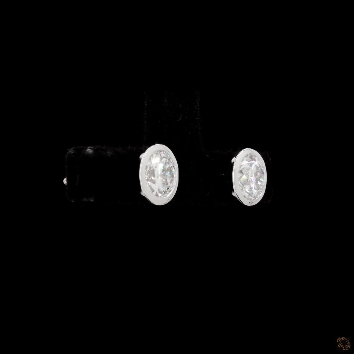 1.54 Ct Upgrade your jewelry wardrobe with sleek bezel-set solitaire diamond stud earrings in round brilliant crafted in 14K white gold with secure push backs