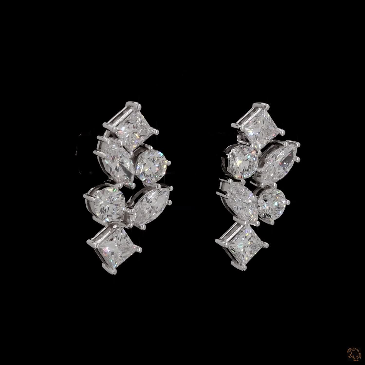 5.6 Ct Vertical cascading cluster capped at the top and bottom by kite-set princess-cut diamonds, sandwiching an alternating pattern of marquise and round brilliant stones