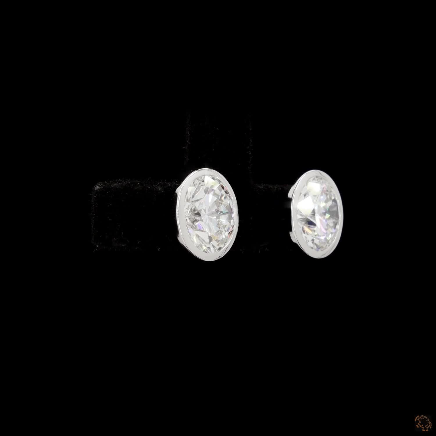 3.08 Bezel-Set Oval Cut Diamond Stud Earrings in White Gold