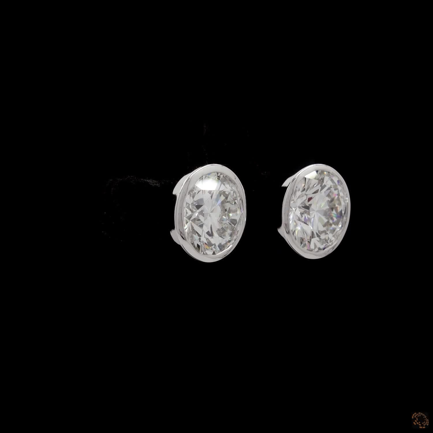5.08 Modern Bezel-Set Oval Diamond Studs in Platinum / White Gold